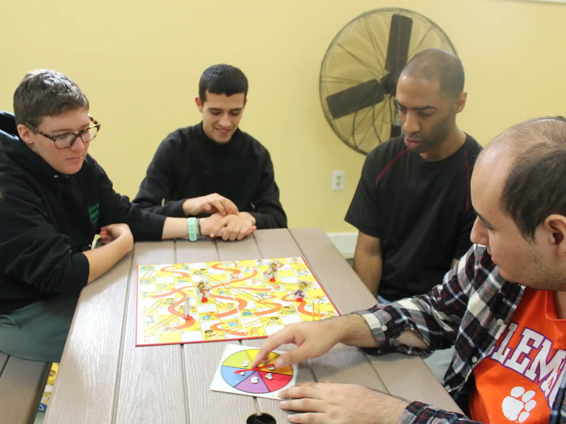 a group of men playing a board game