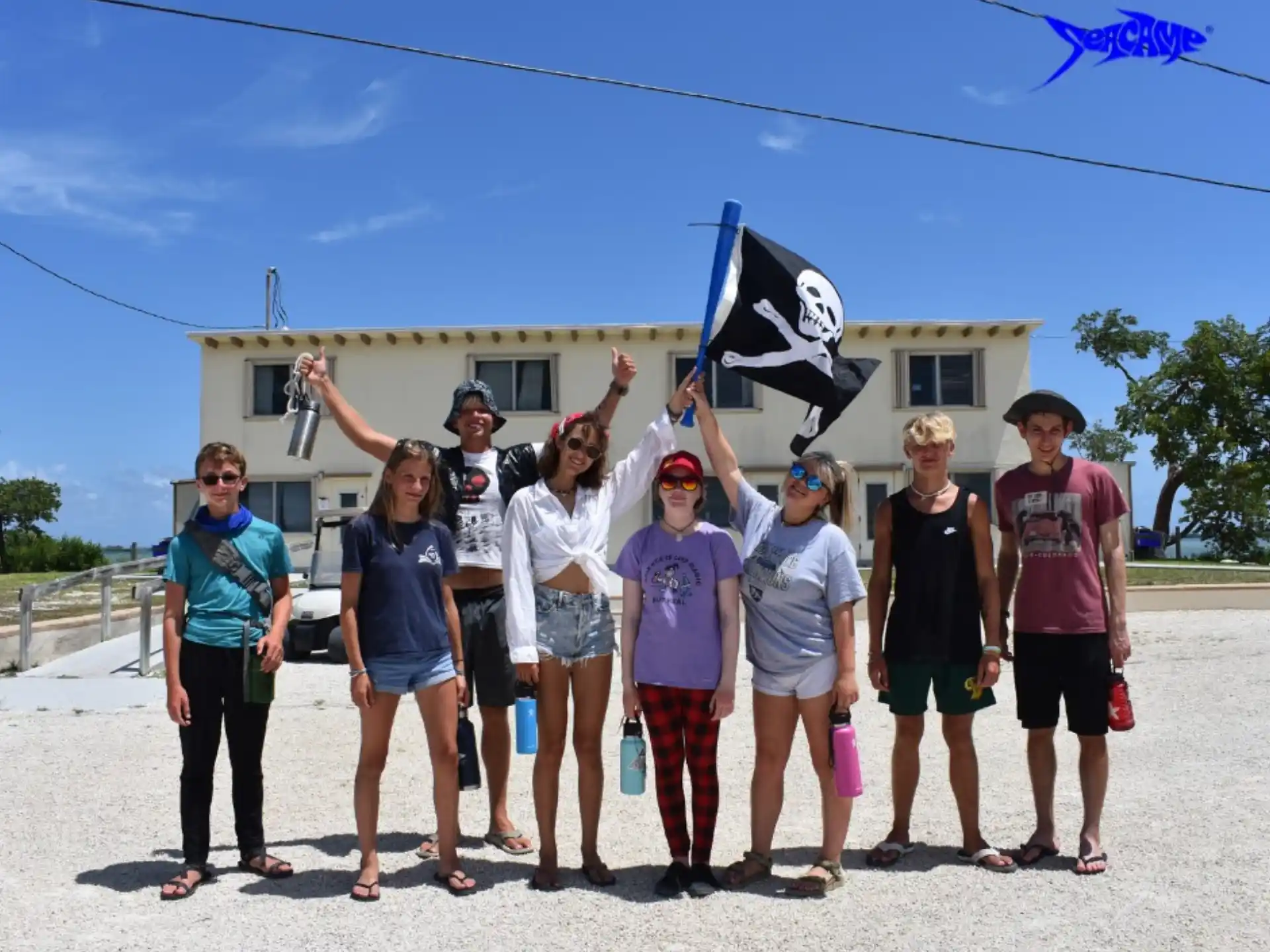 a group of people holding kites