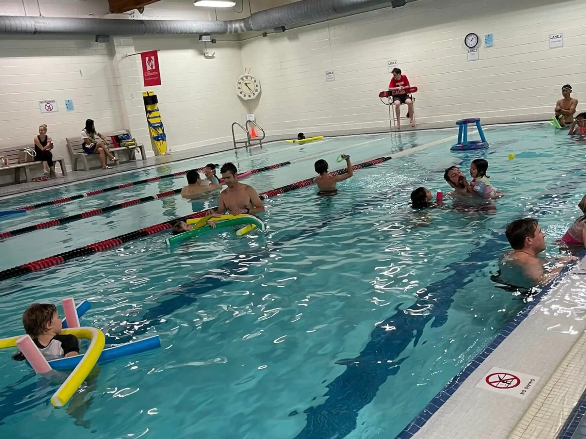 a group of people in a swimming pool