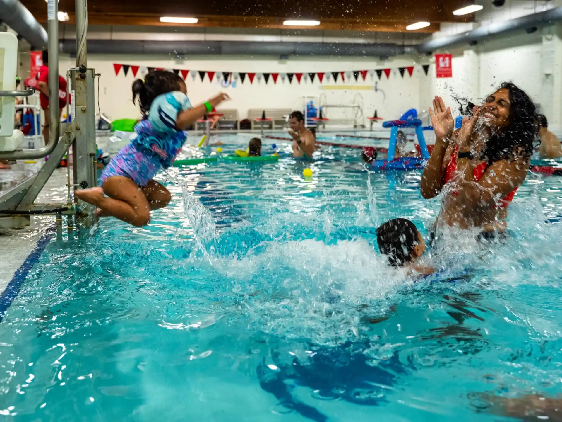 a group of people playing in a pool