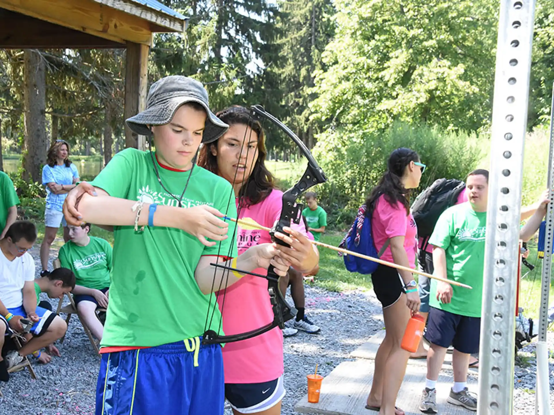 a group of people holding bows and arrows