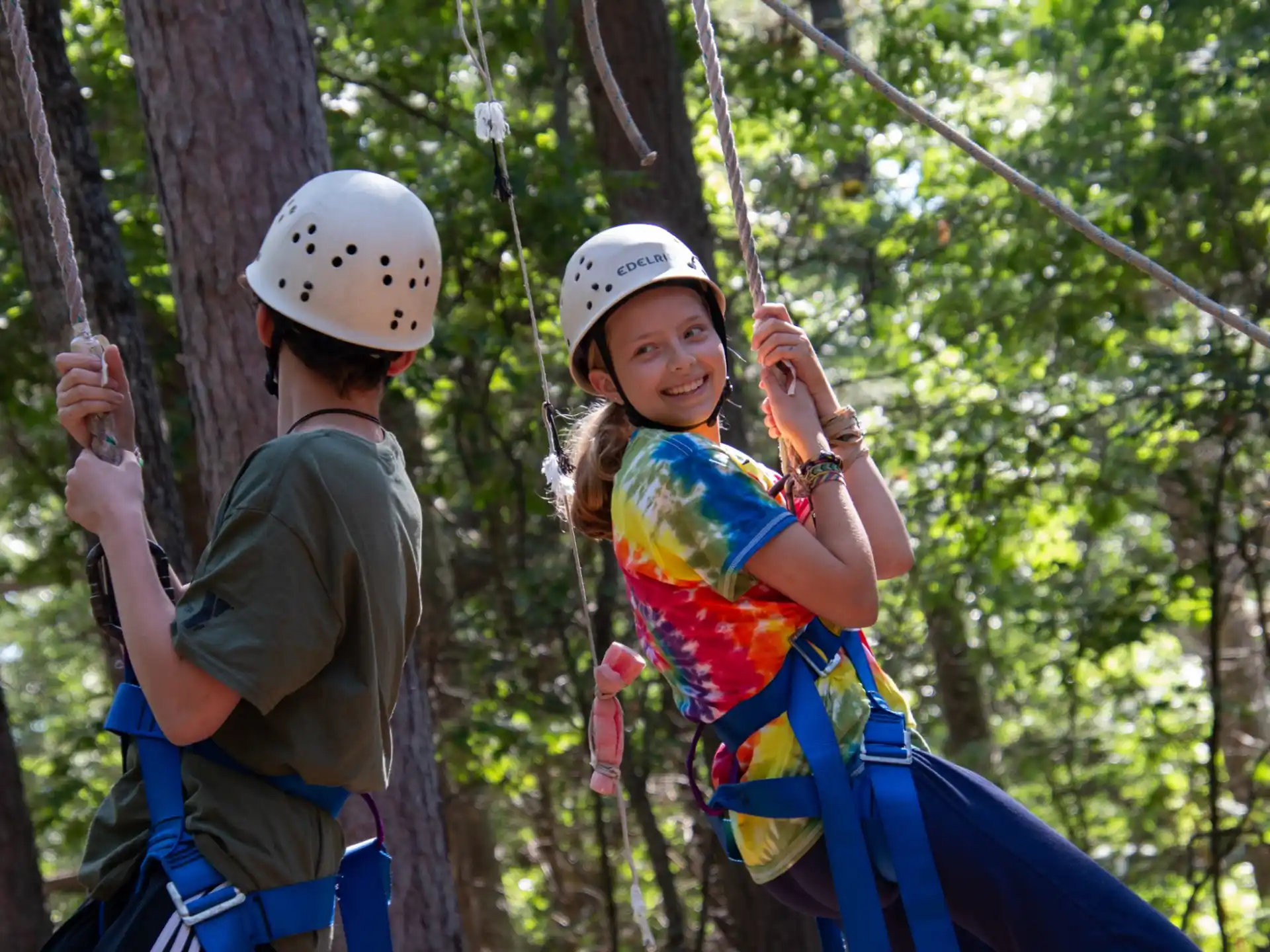 a man and a boy on a zip line