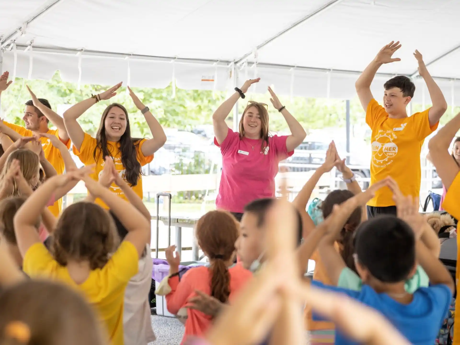 a group of people raising their hands