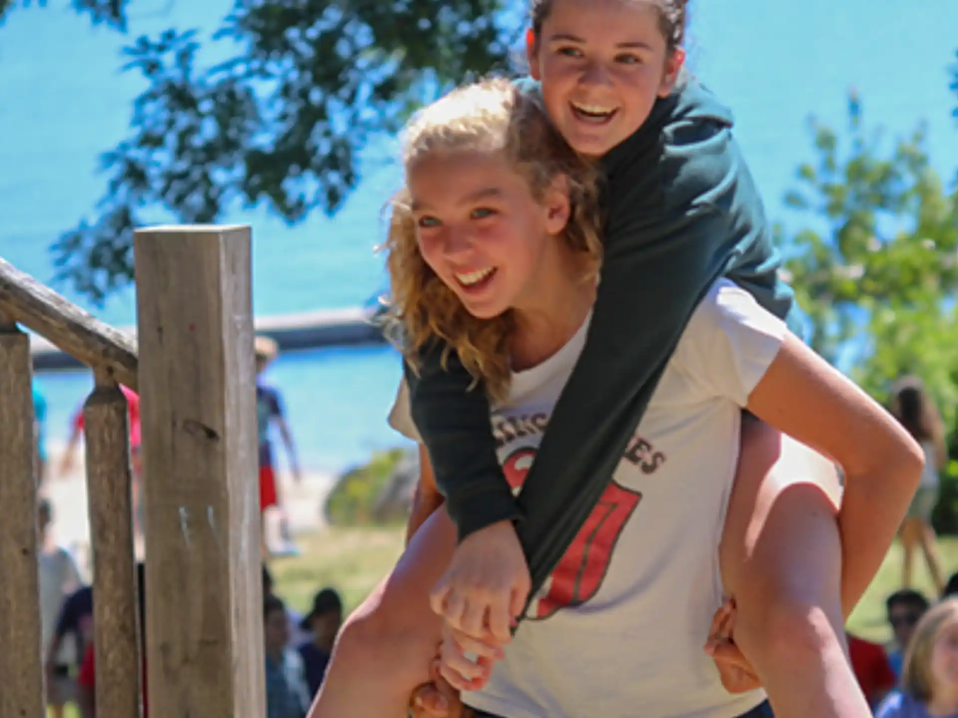 a woman carrying a man on her back