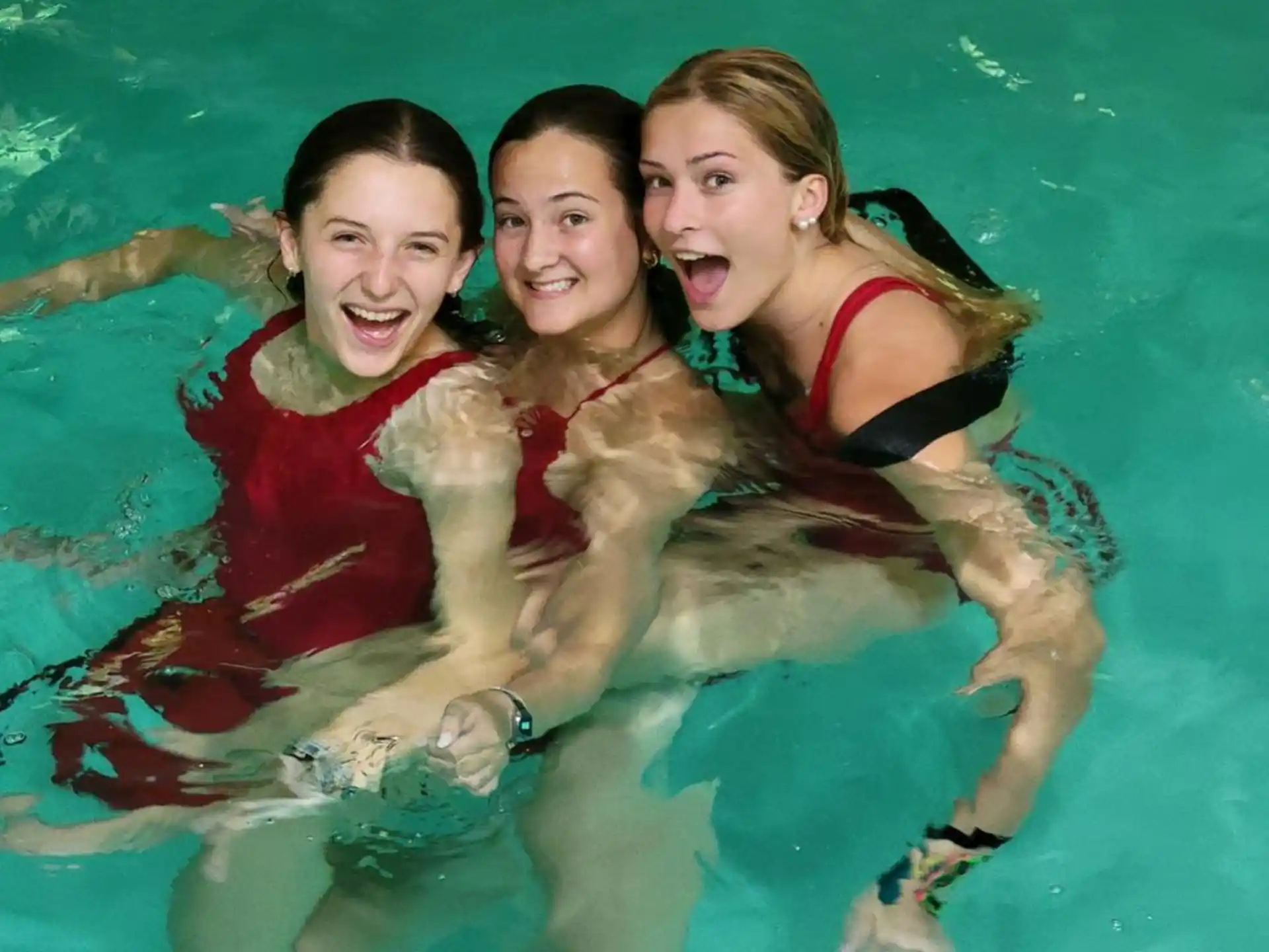 a group of women in a pool