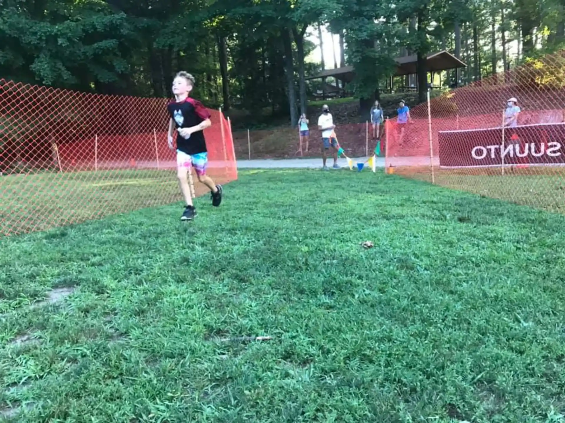 a boy running on a field