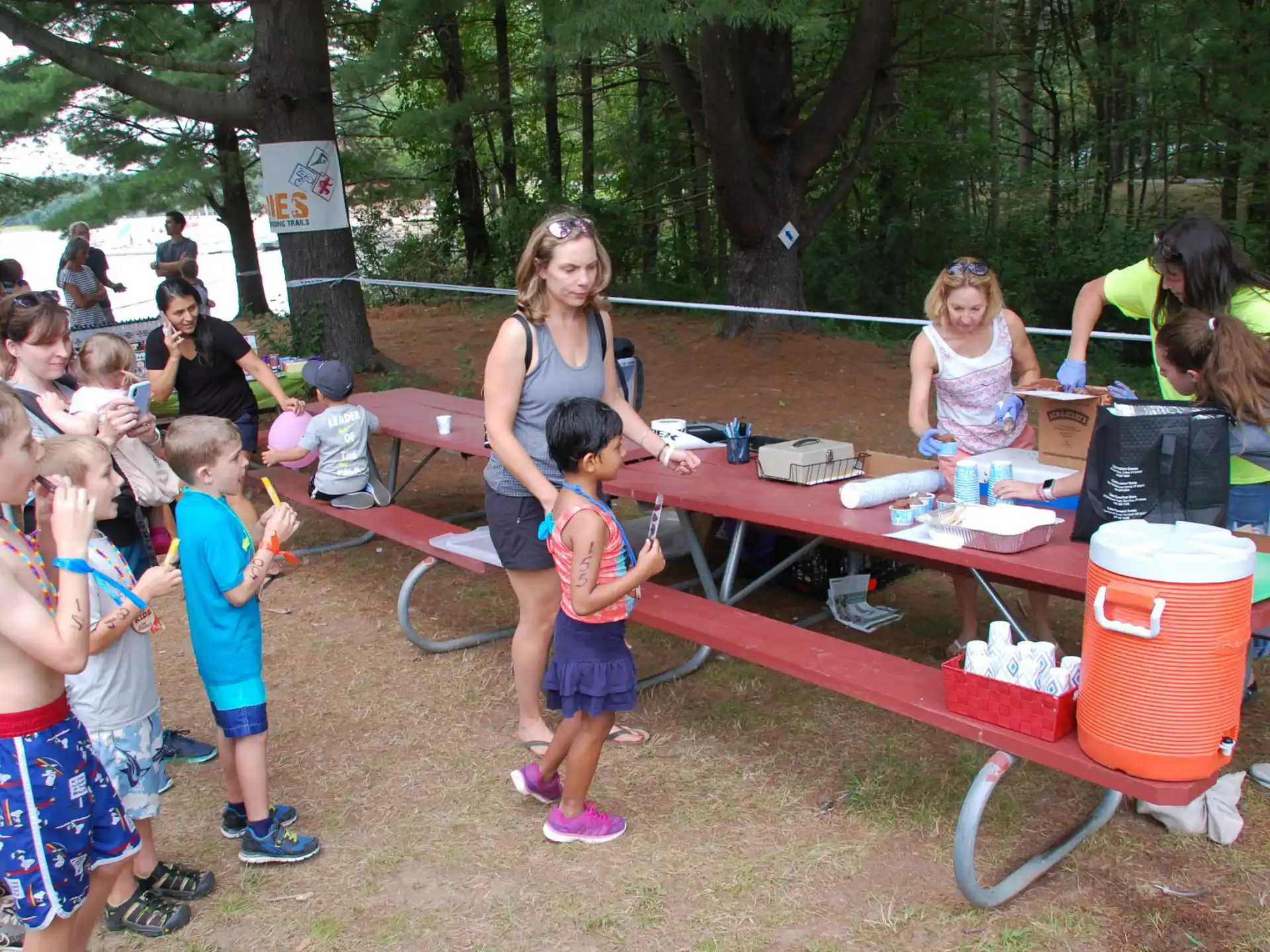 a group of children at a picnic table
