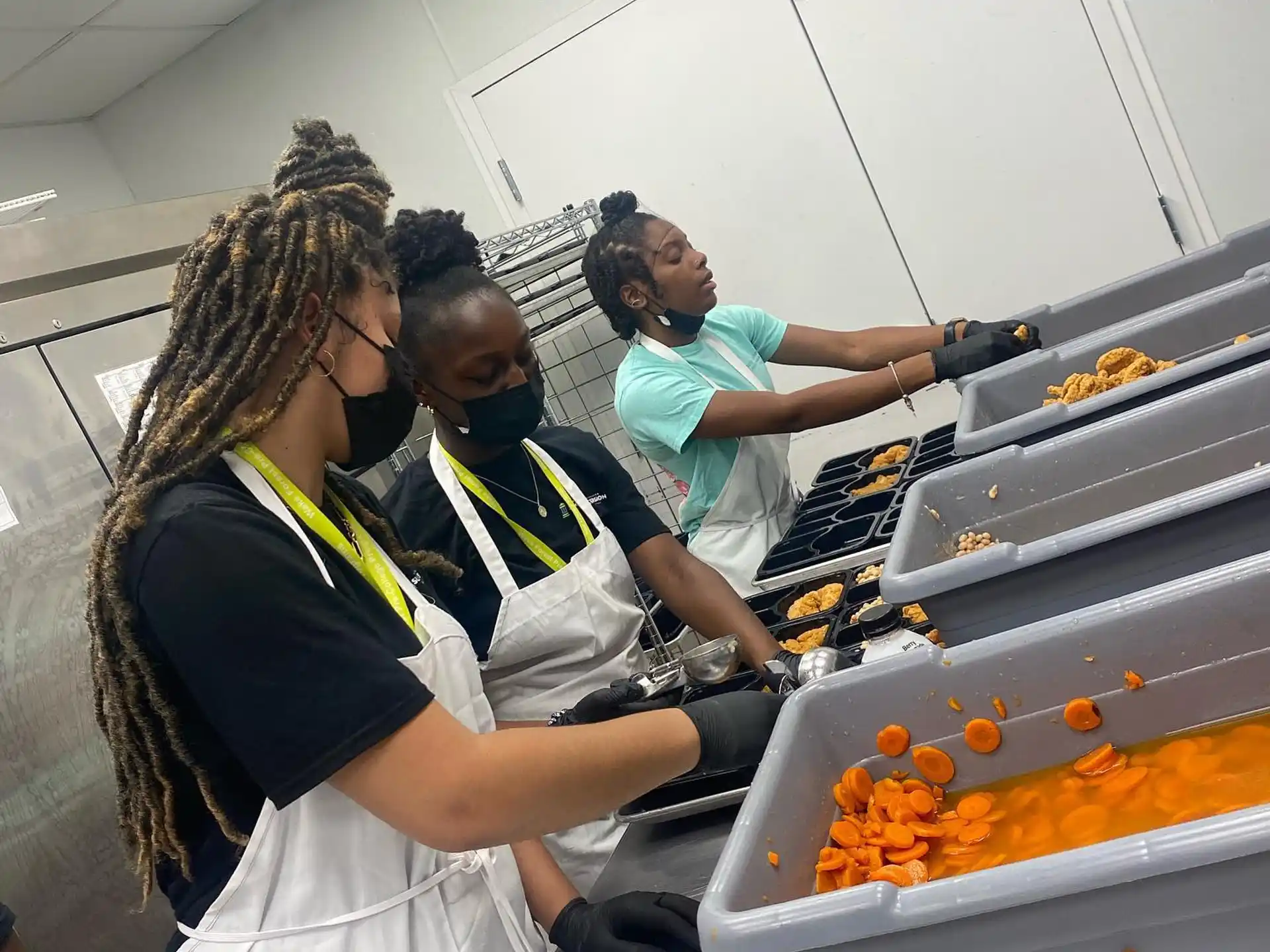 a group of people preparing food