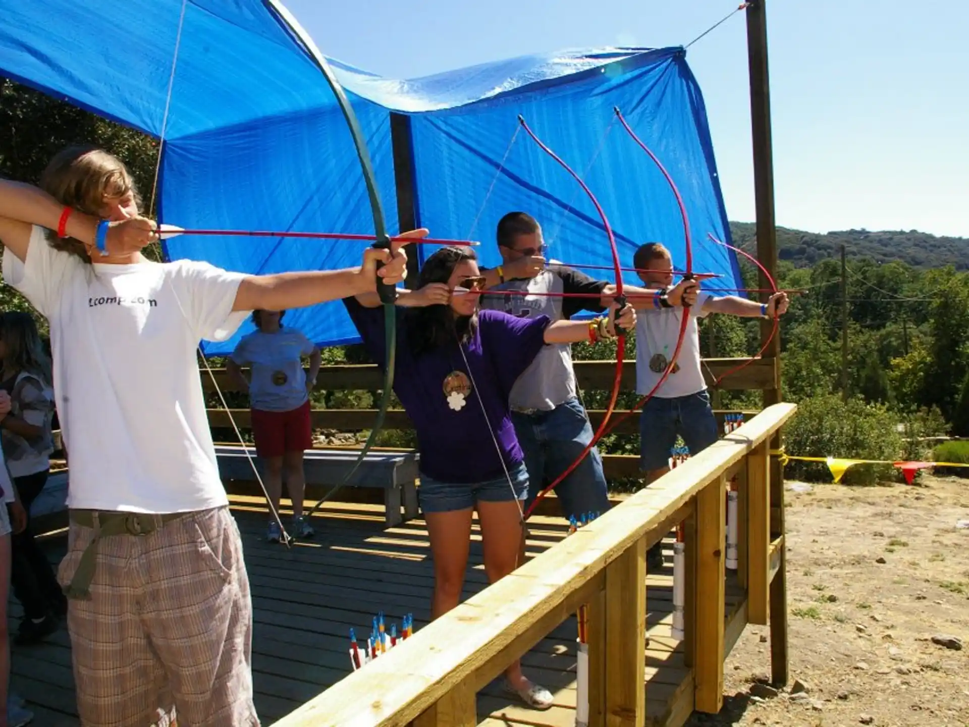 a group of people on a wooden structure