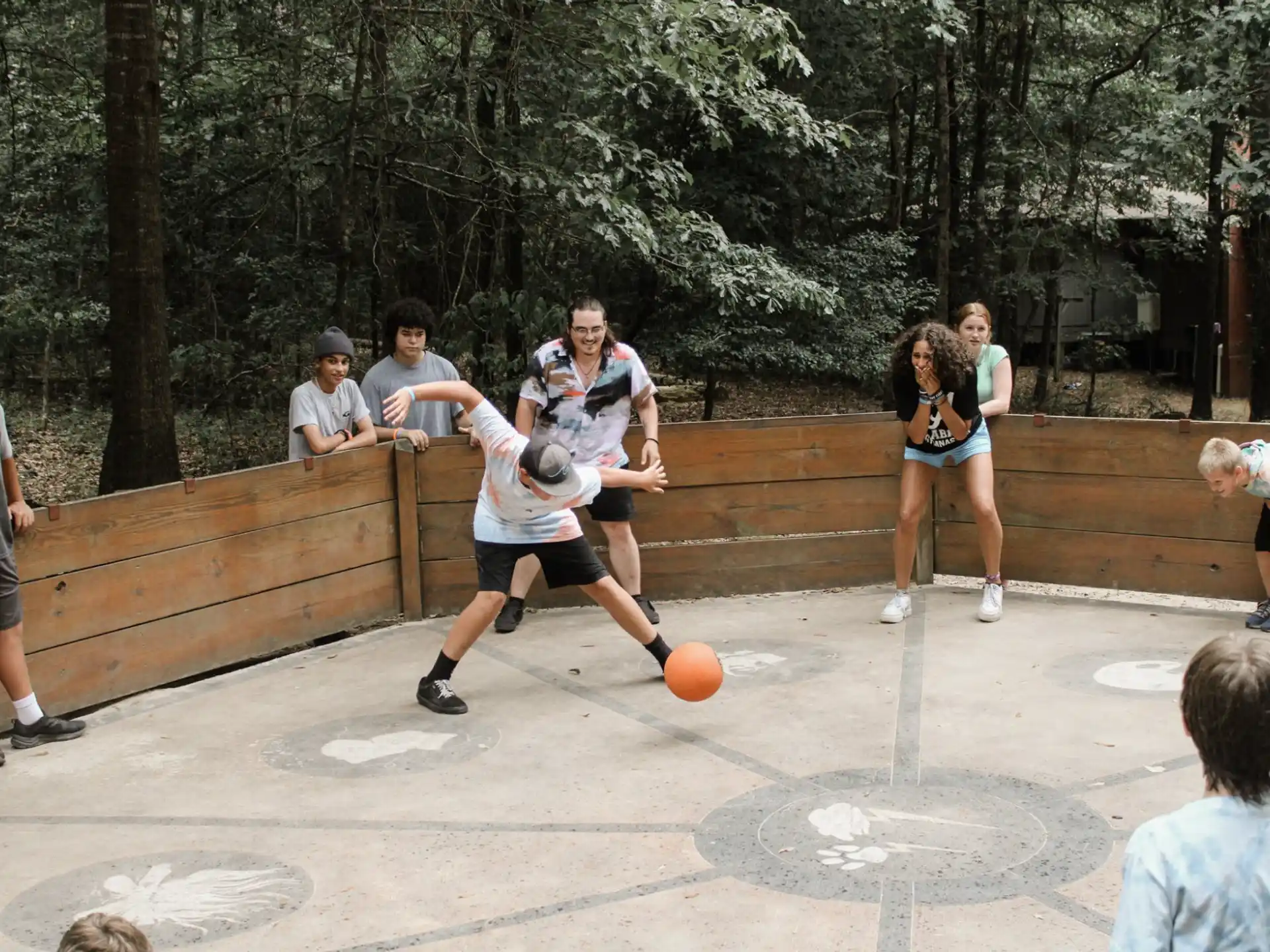 a group of people playing basketball