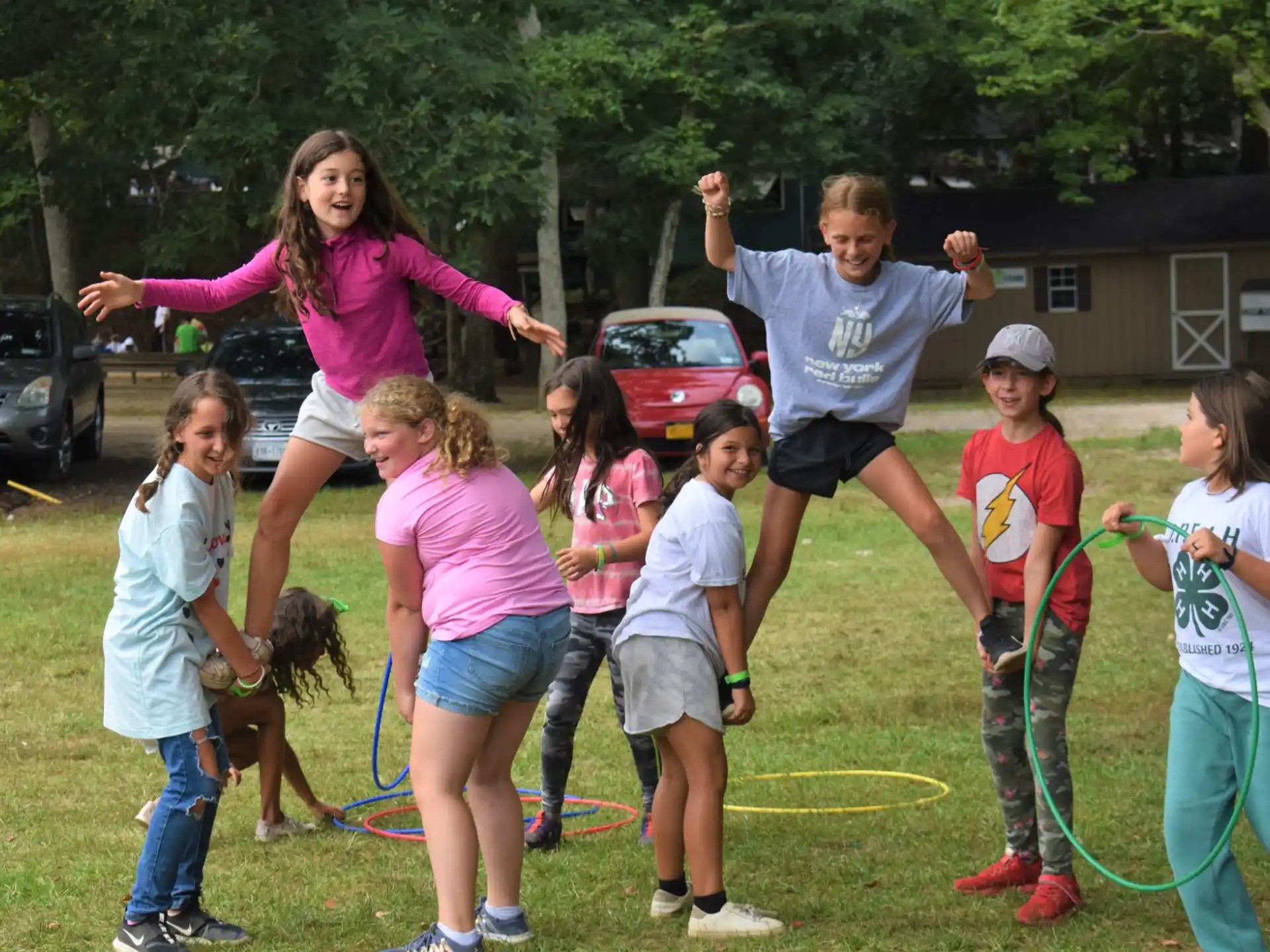 a group of people playing in a yard