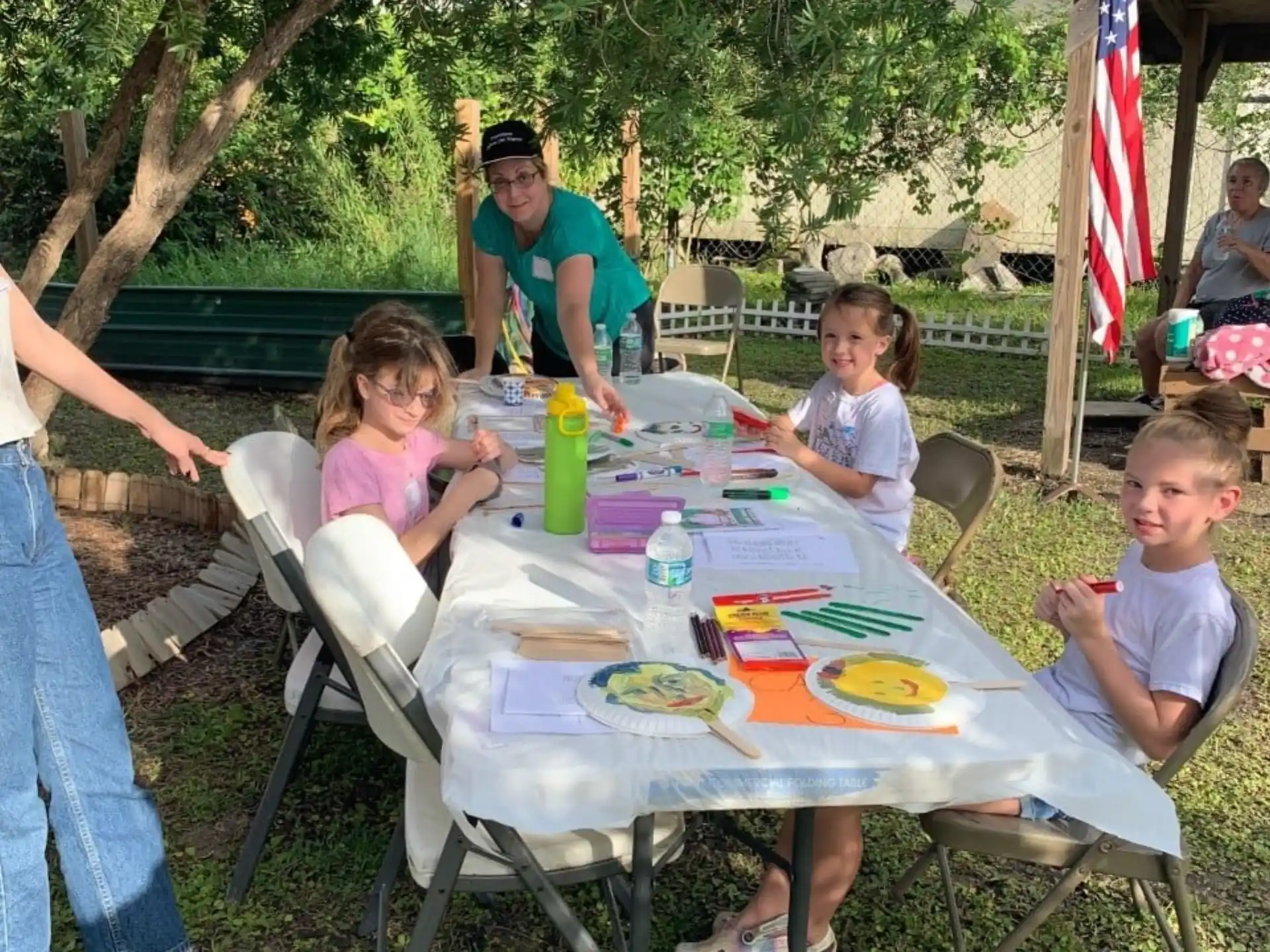 a group of kids eating at a table
