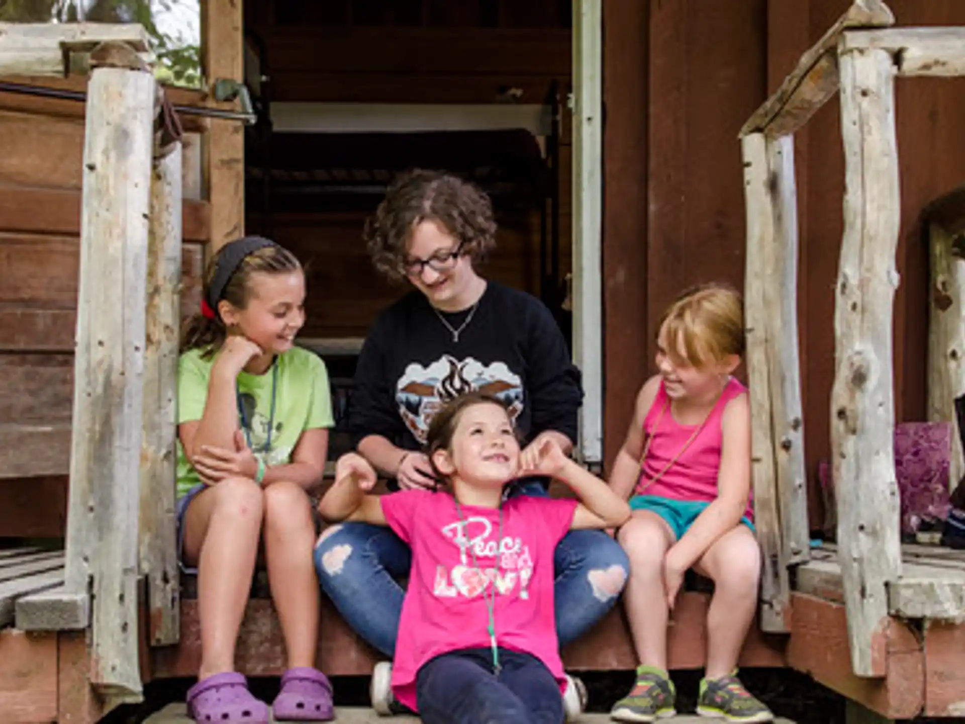 a group of people sitting on a porch