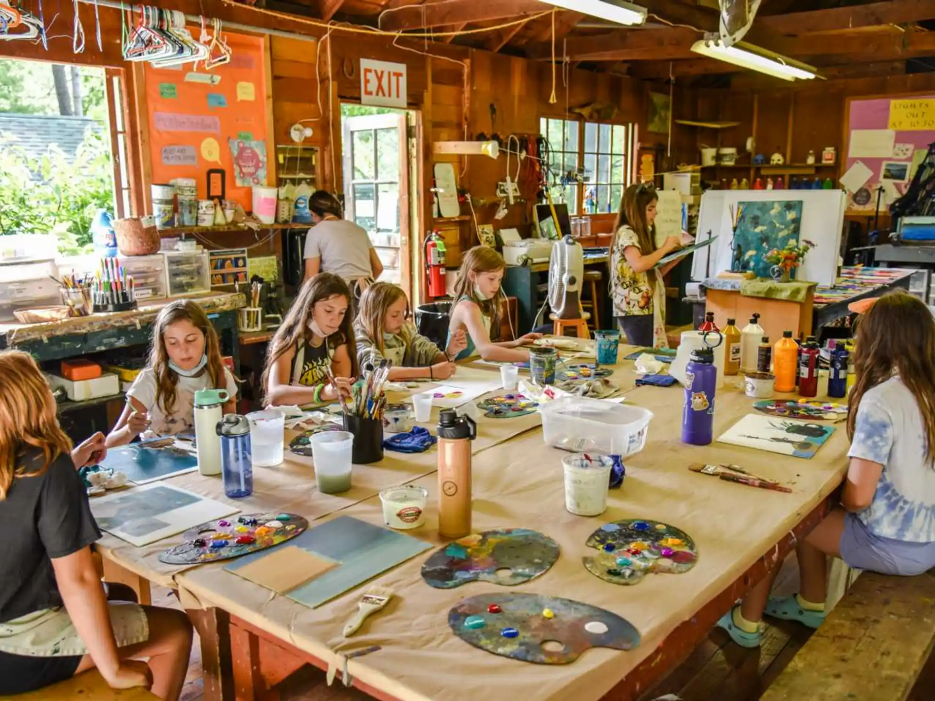 a group of people painting