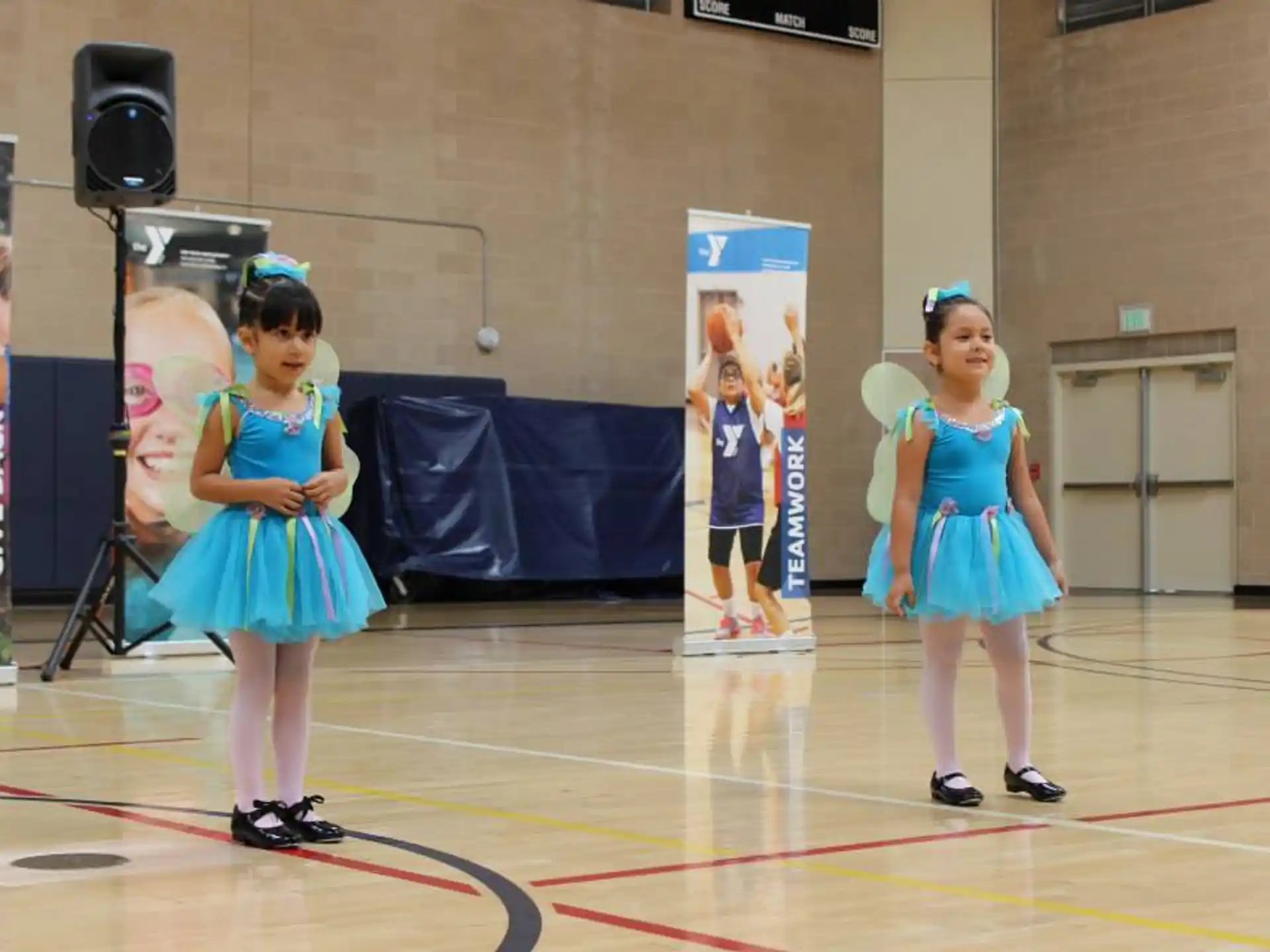 a couple of girls in blue dresses