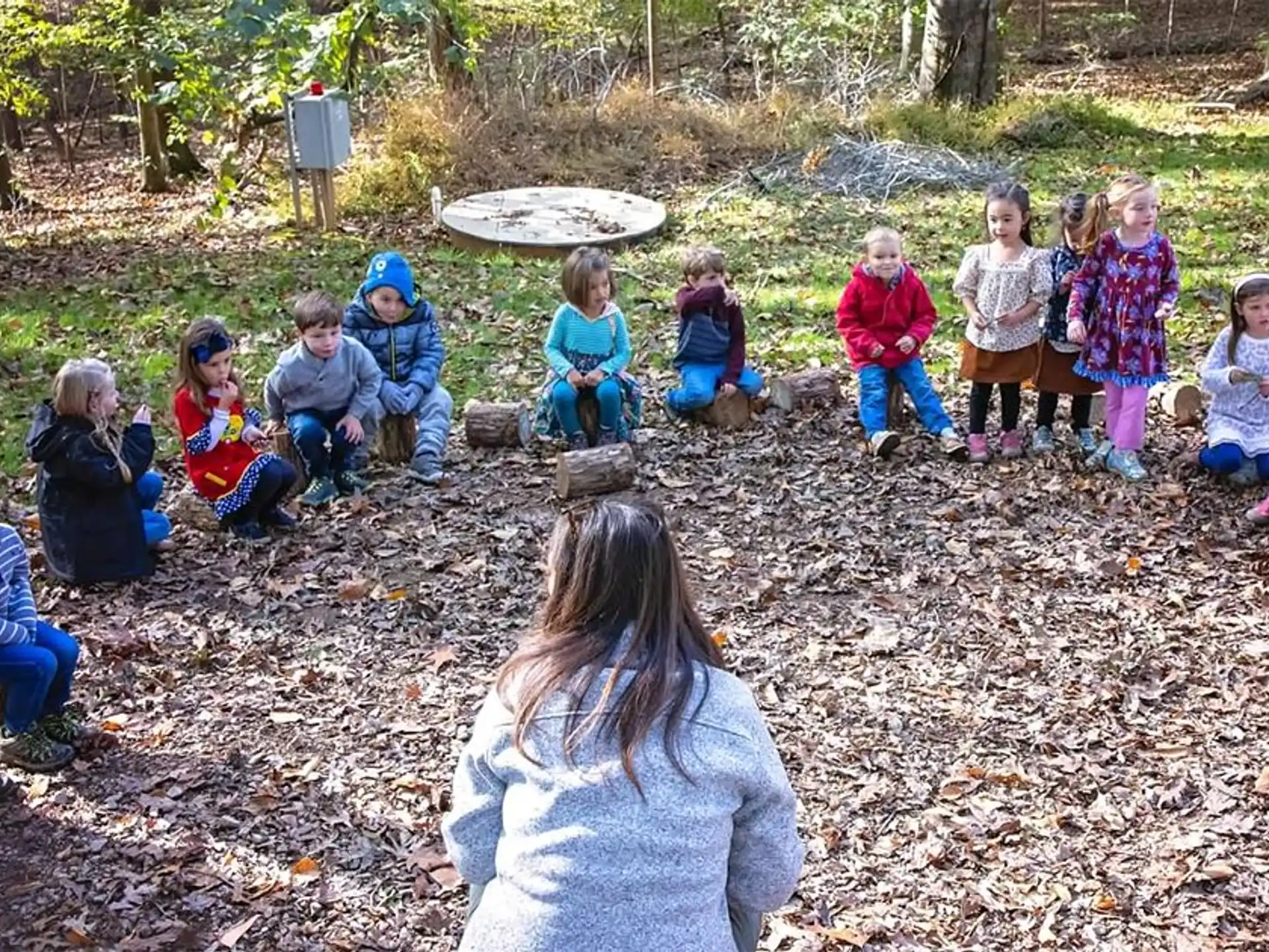 a group of children sitting on the ground