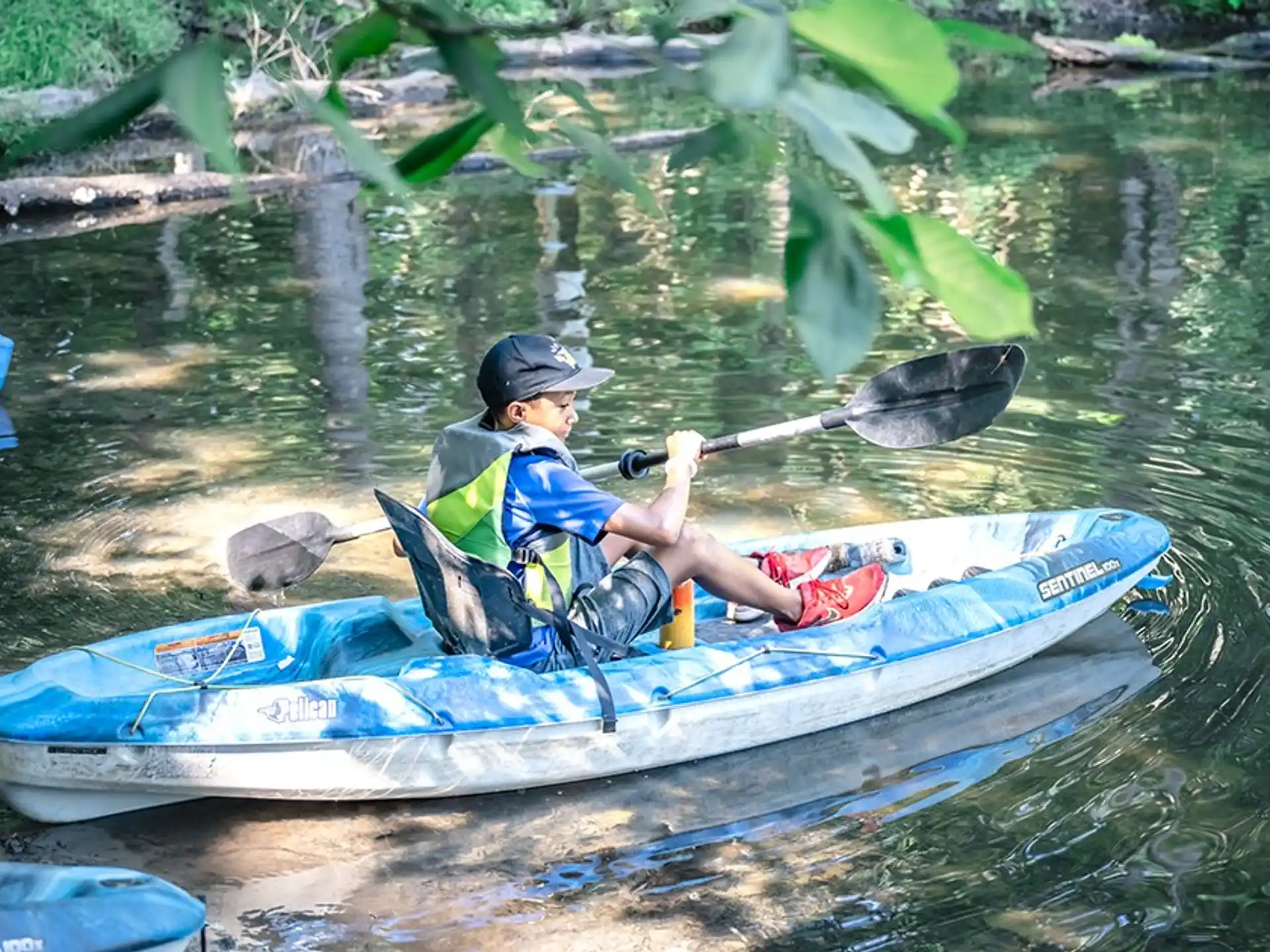 a person in a kayak on a river
