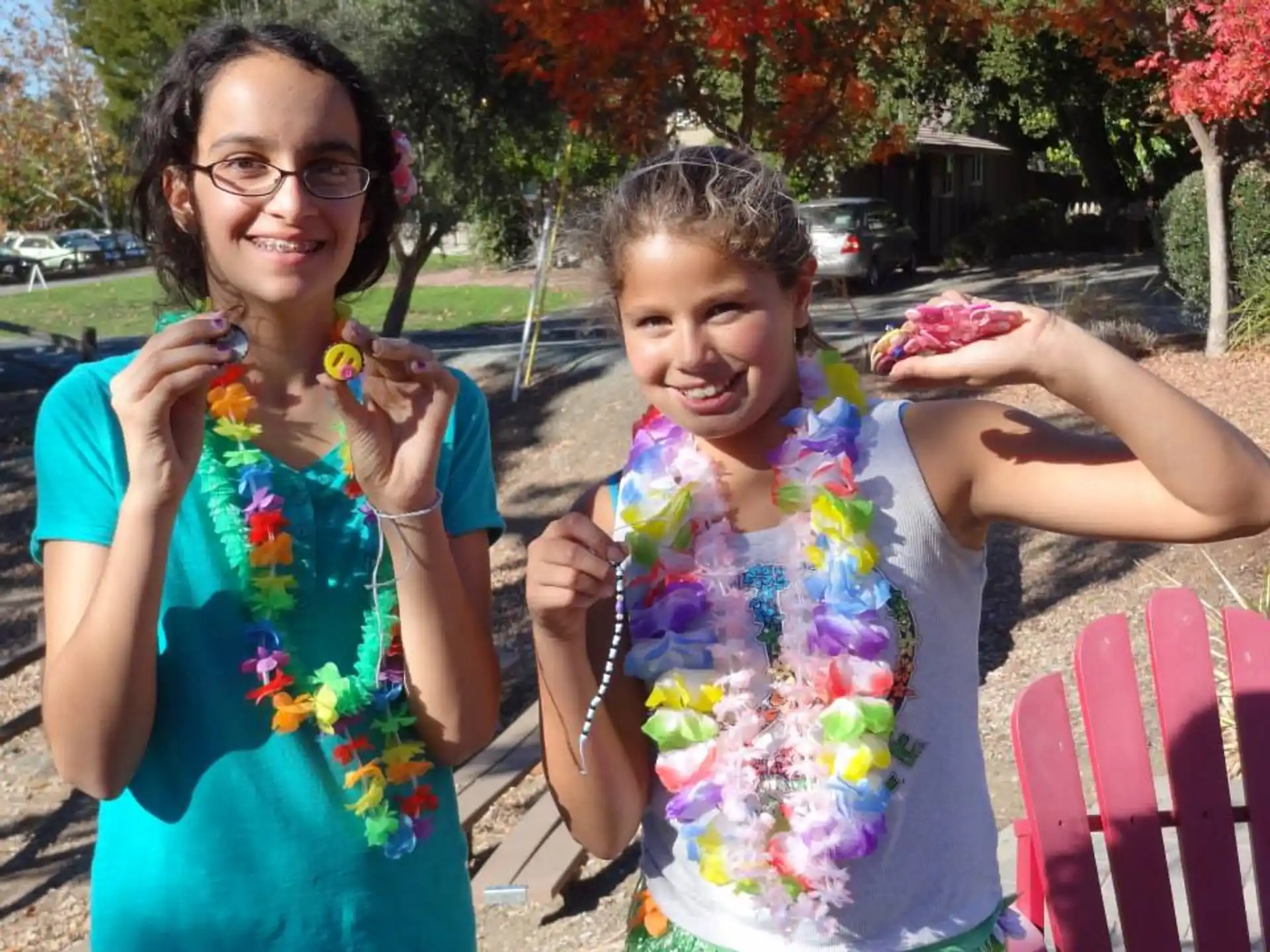 a couple of girls holding flowers