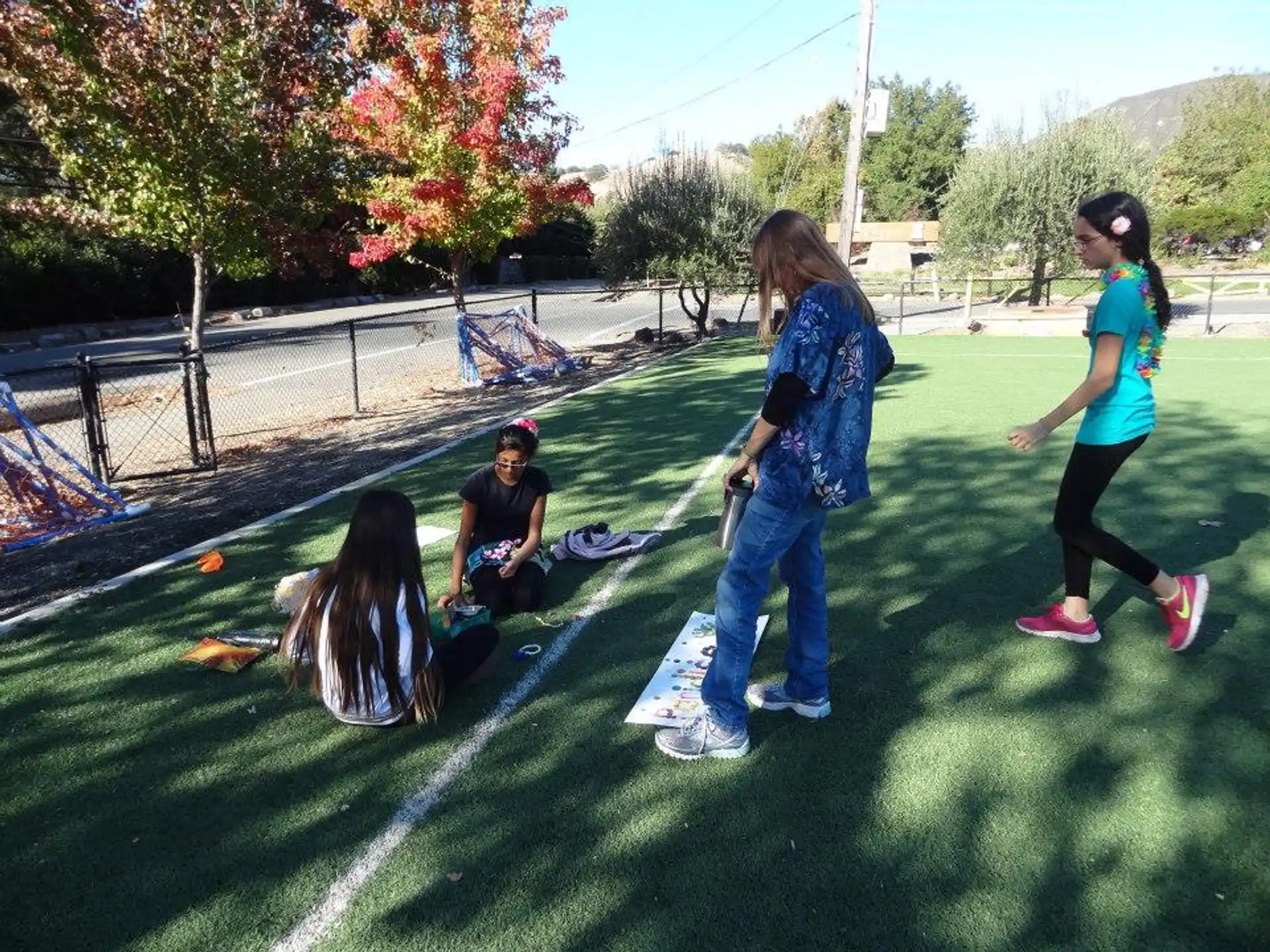 a group of people playing in a yard