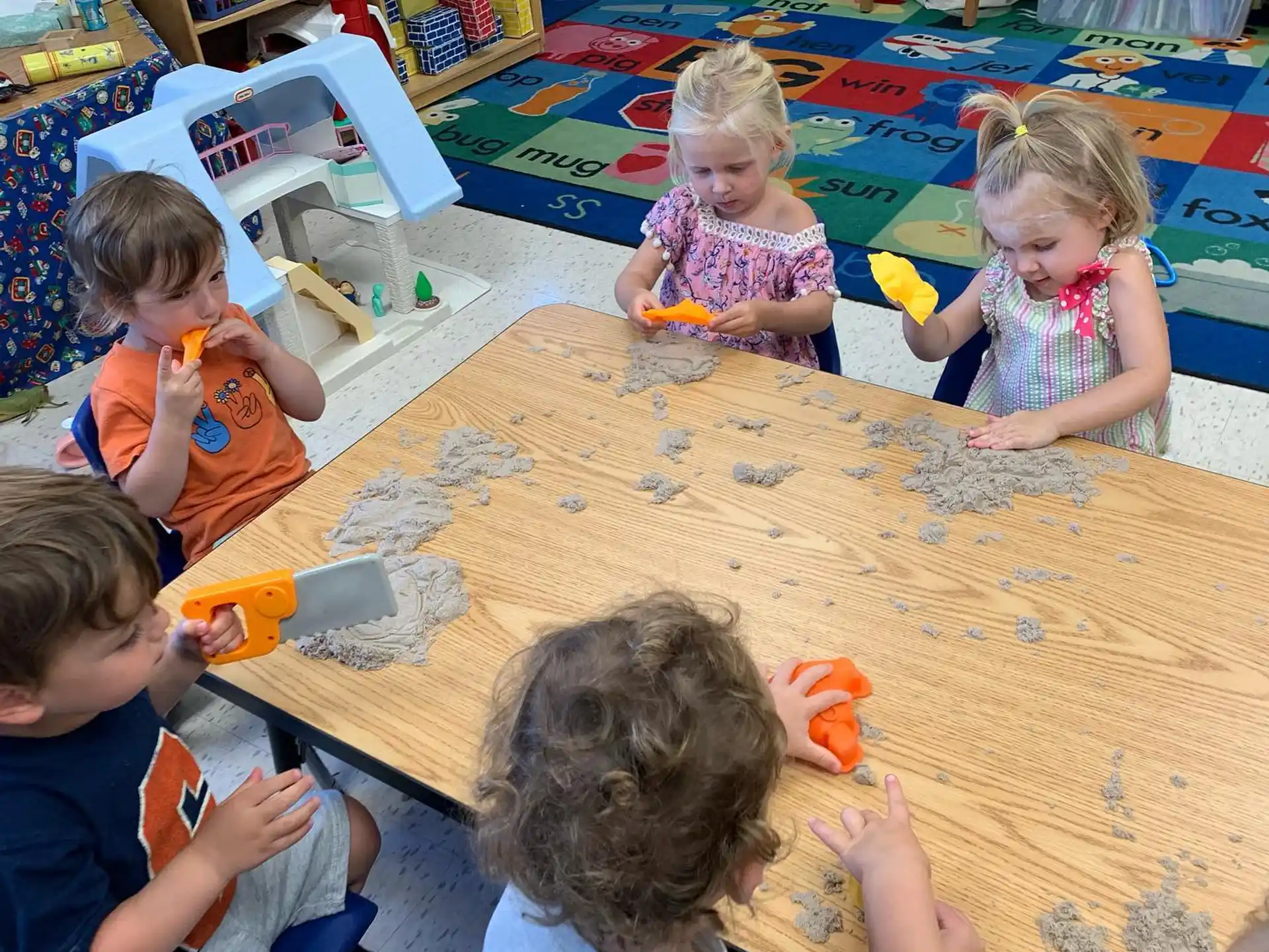 a group of children playing with toys