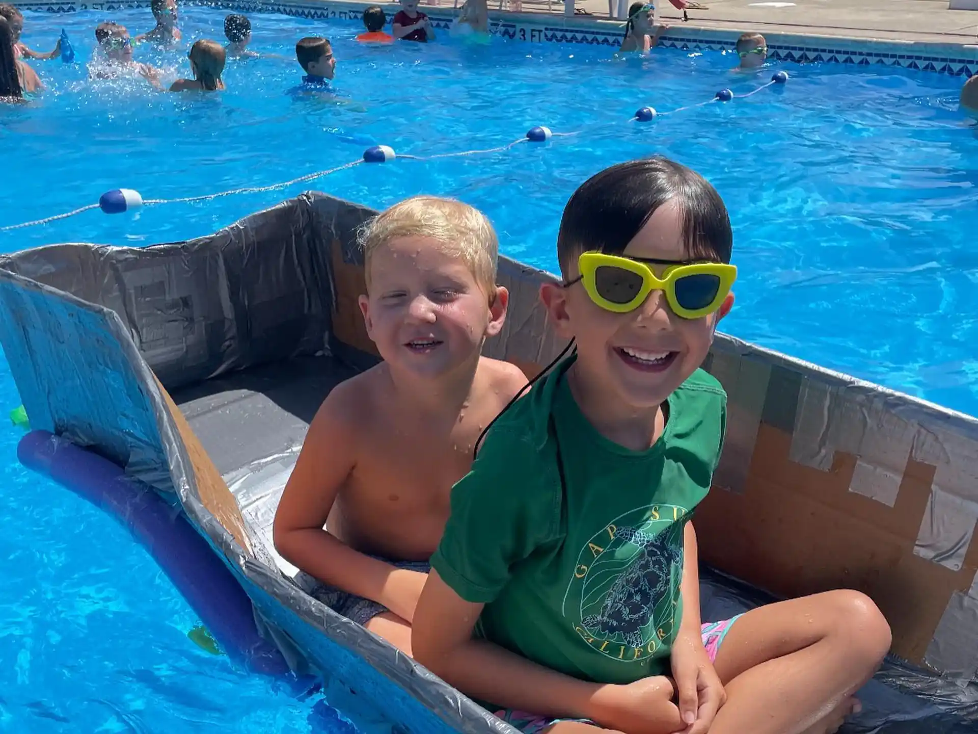two boys in a pool