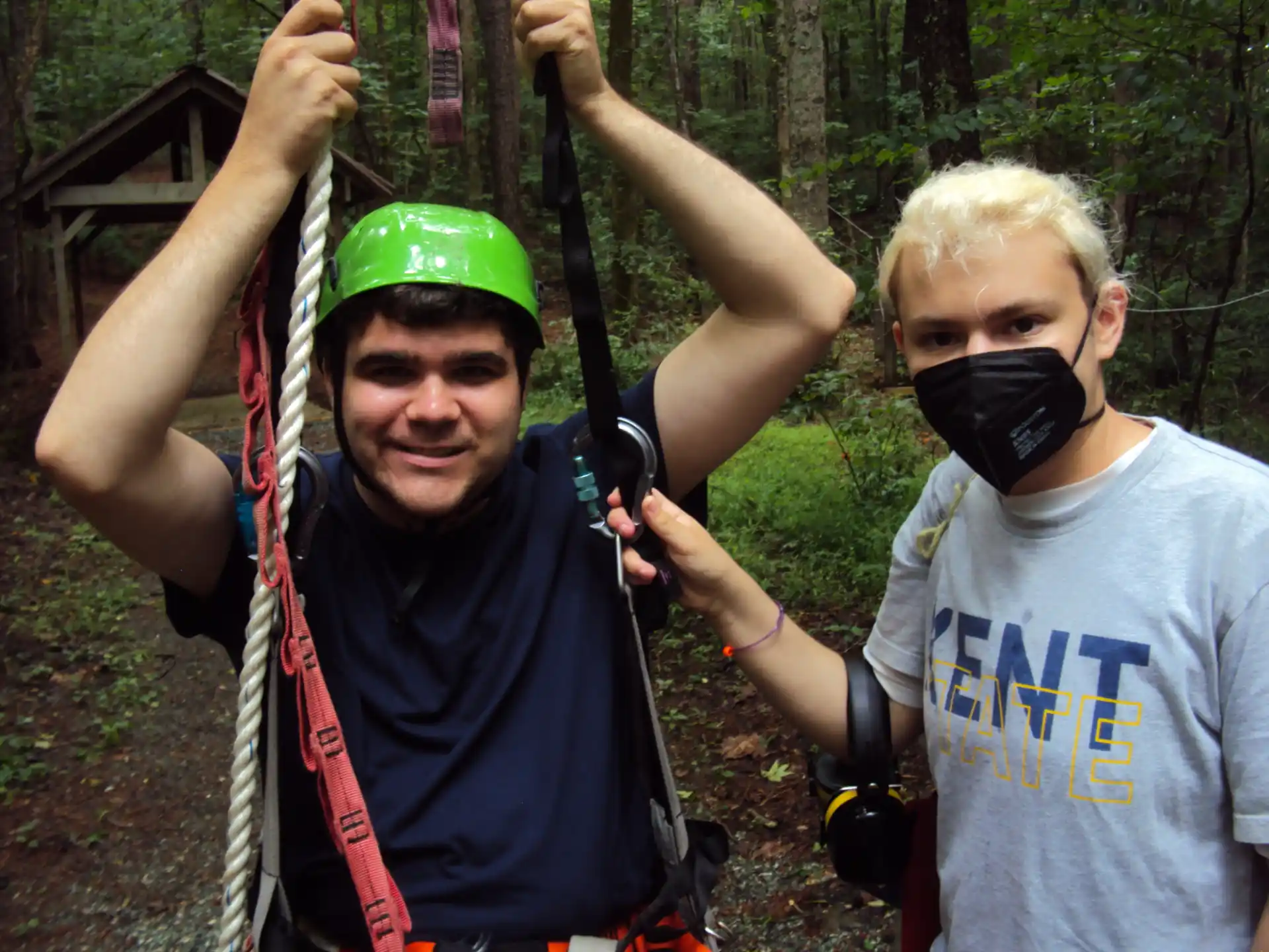 a group of people holding onto a rope