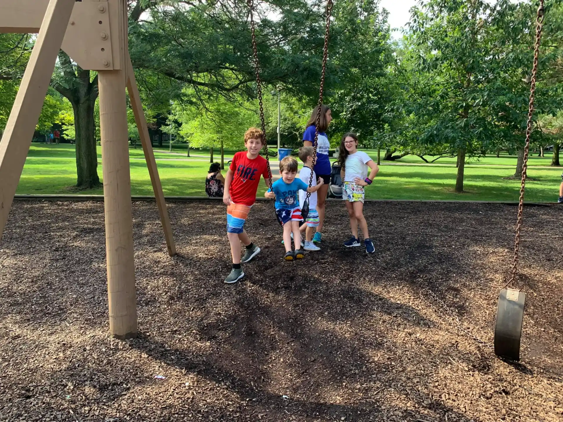 a group of kids on swings