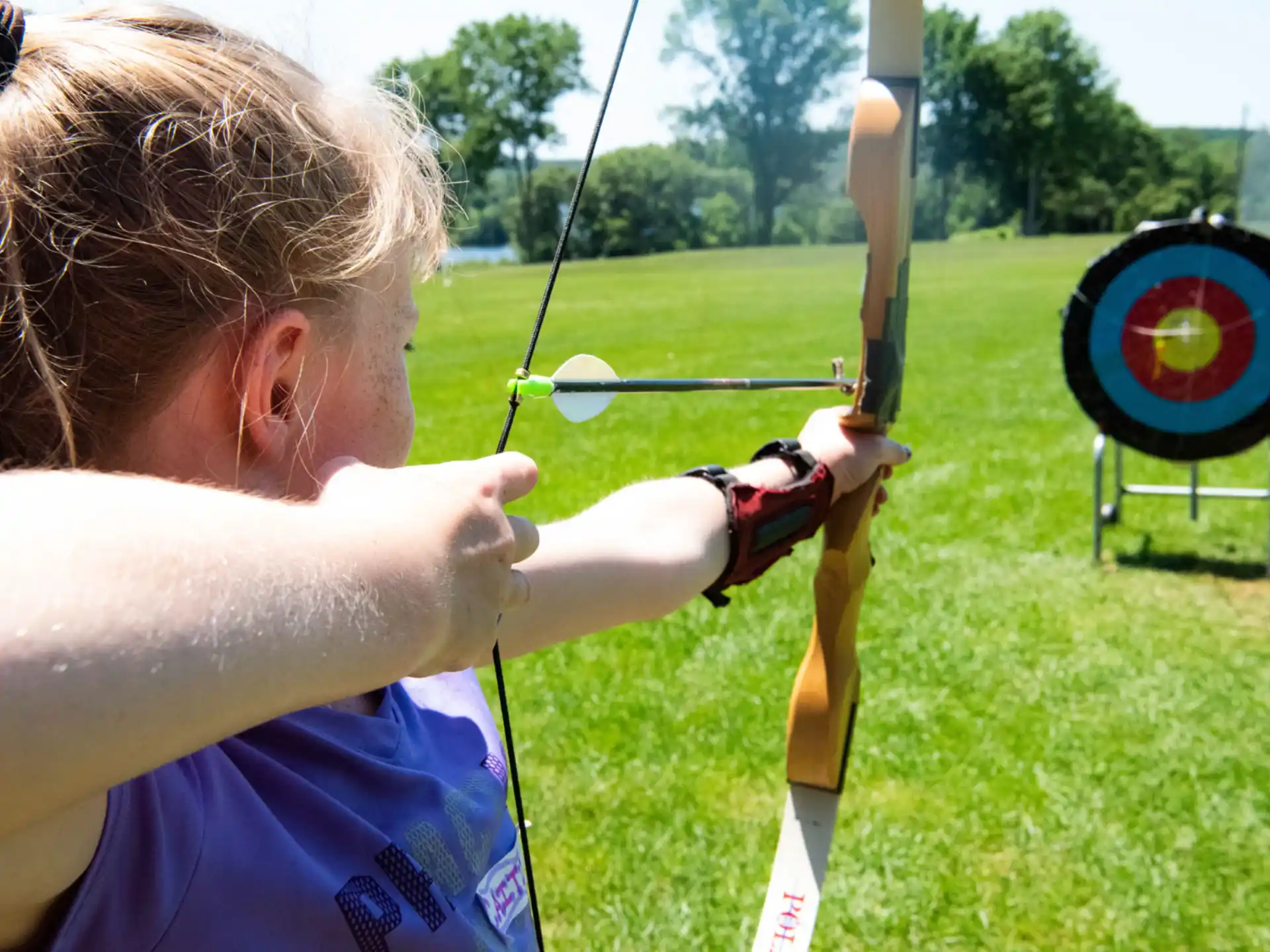 a person shooting a bow and arrow
