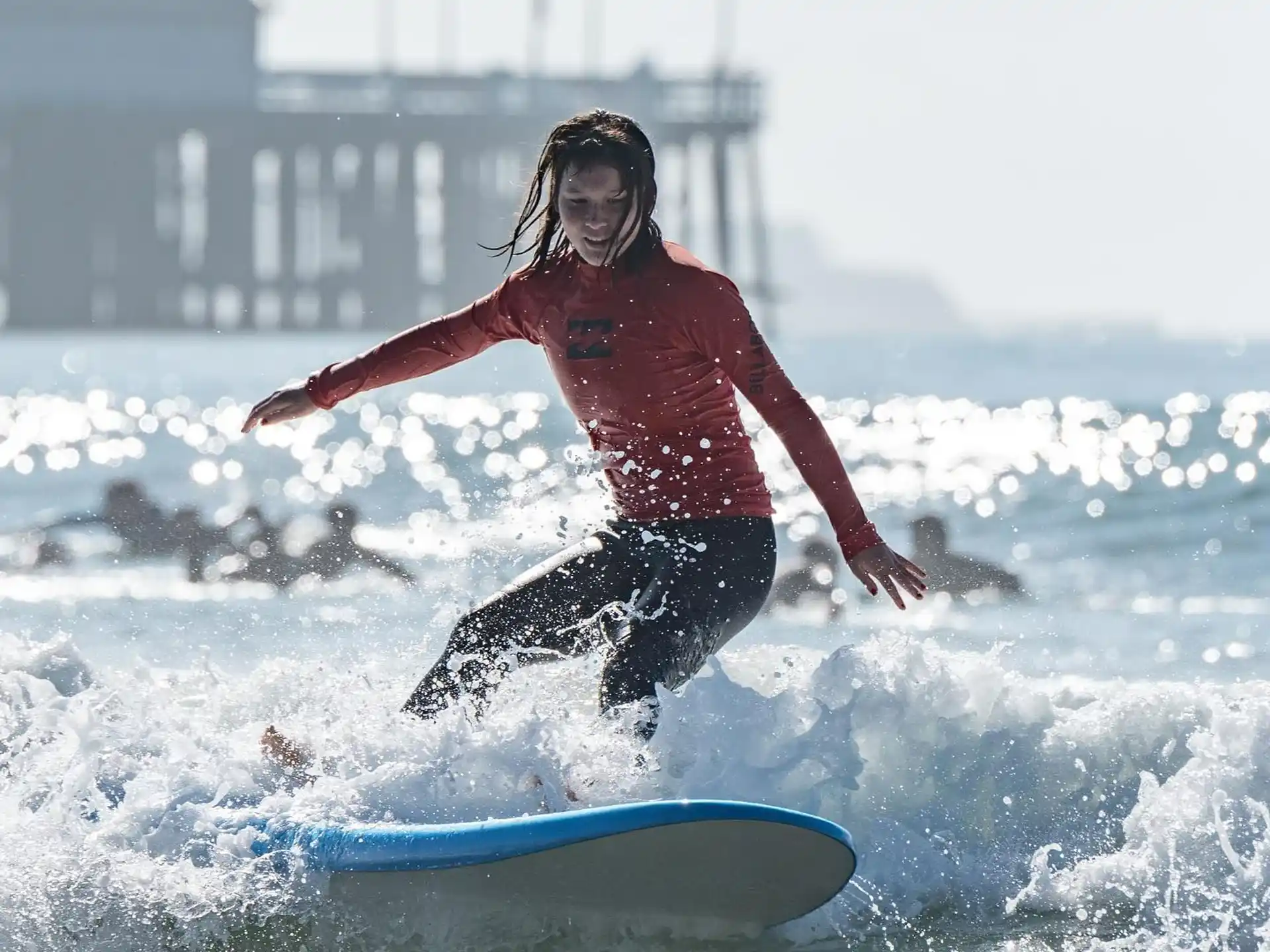 a man riding a surfboard