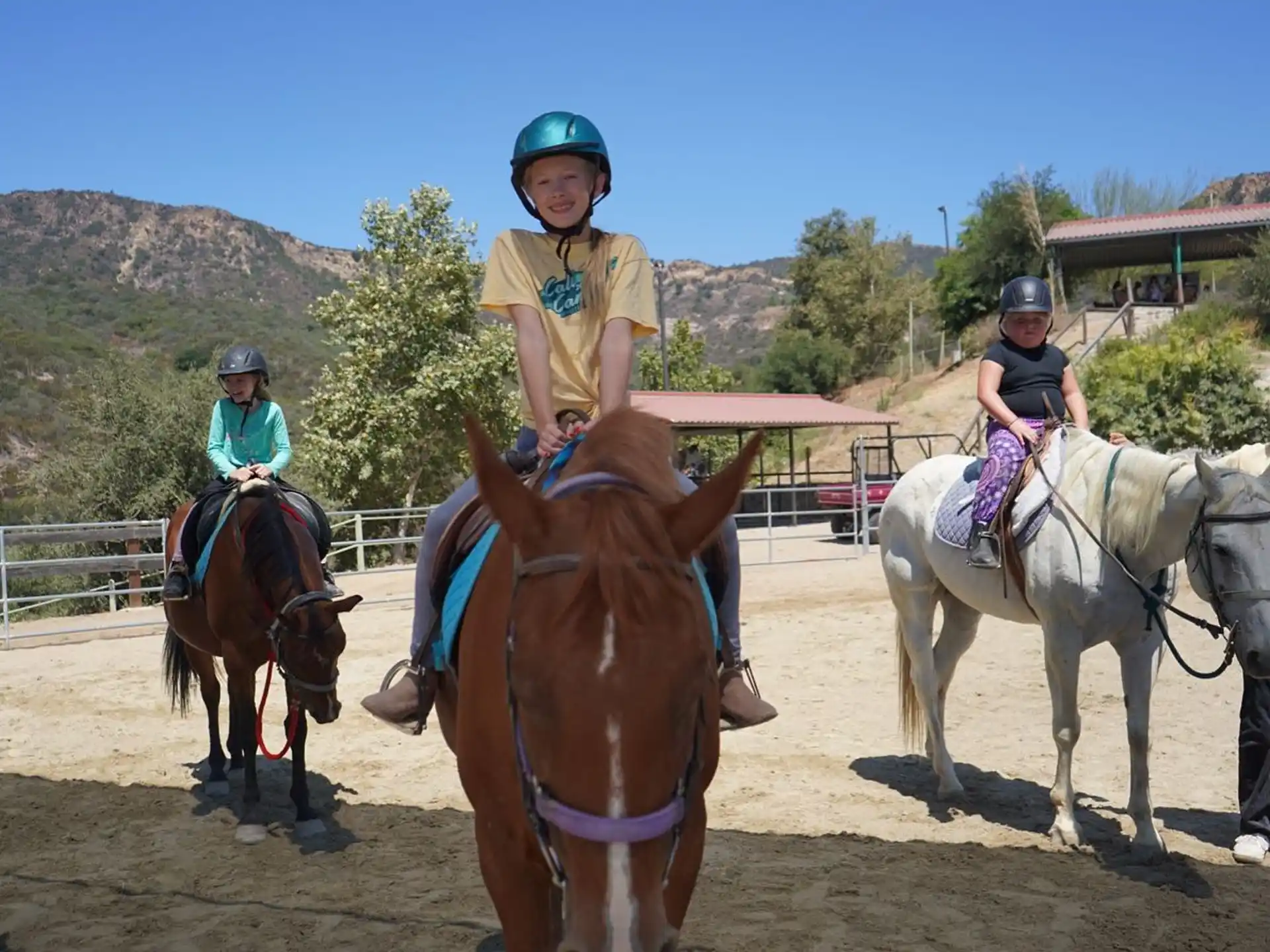 a group of people riding horses