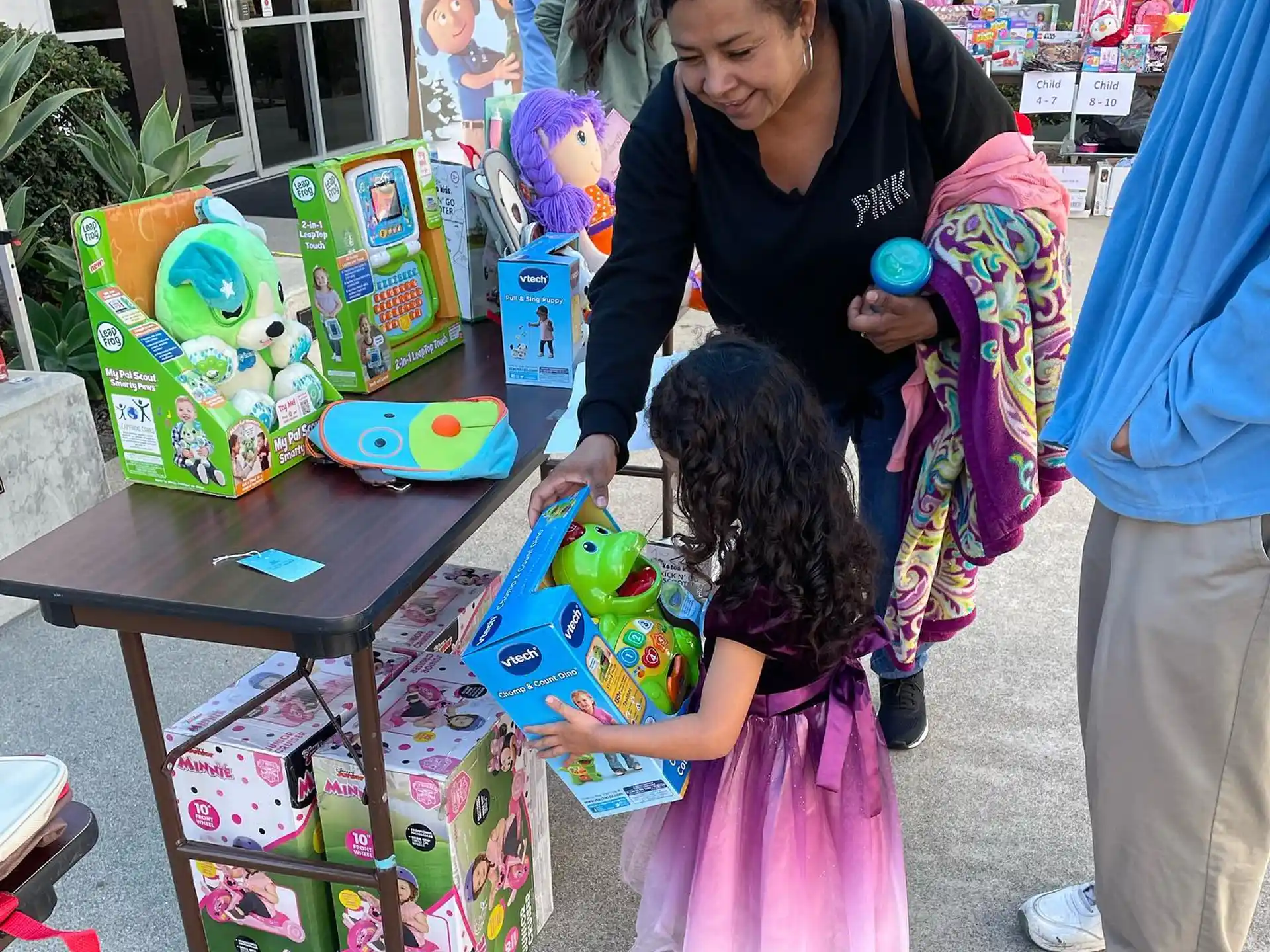 a person and a child playing with toys