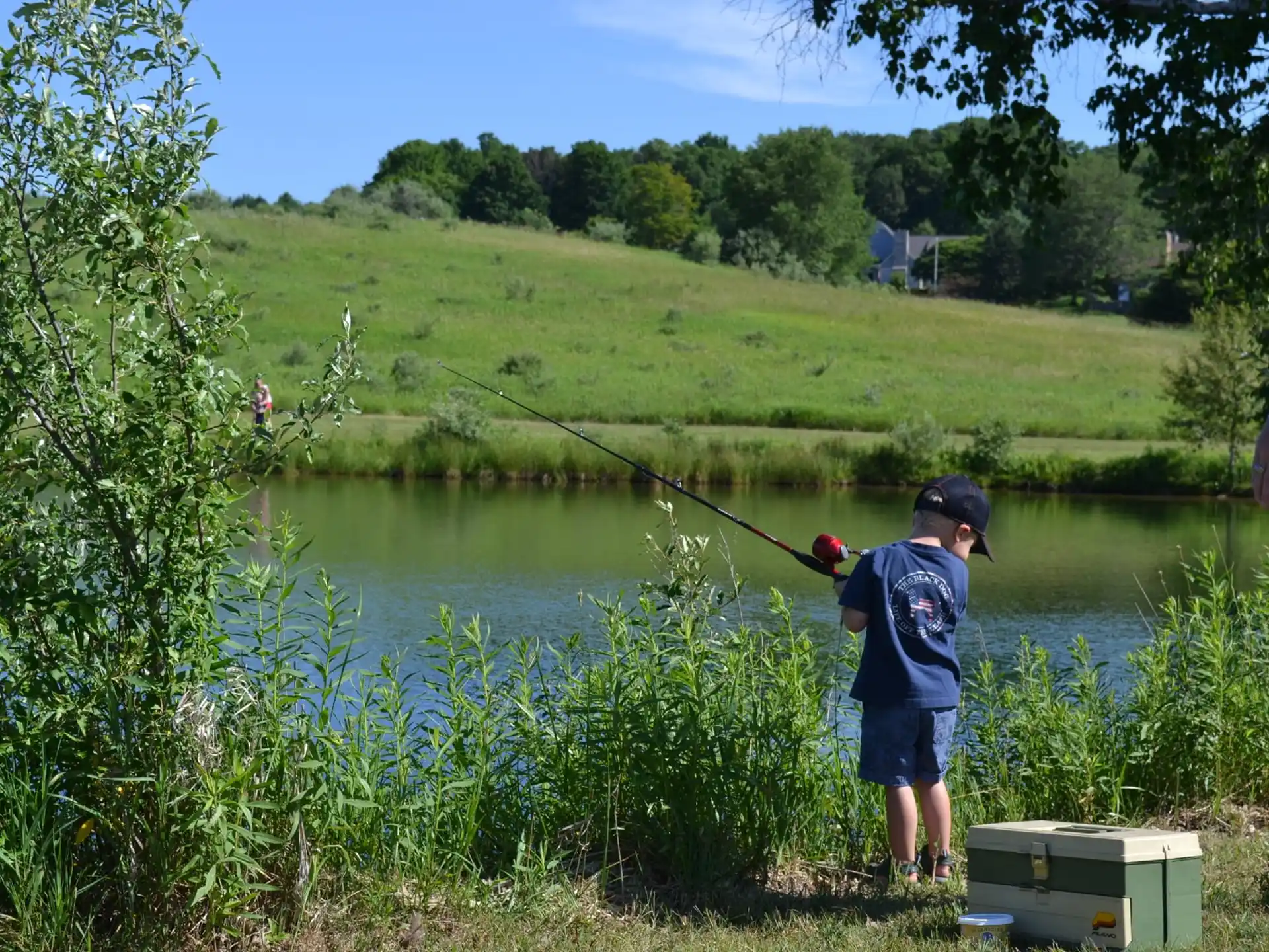 a man fishing in a pond