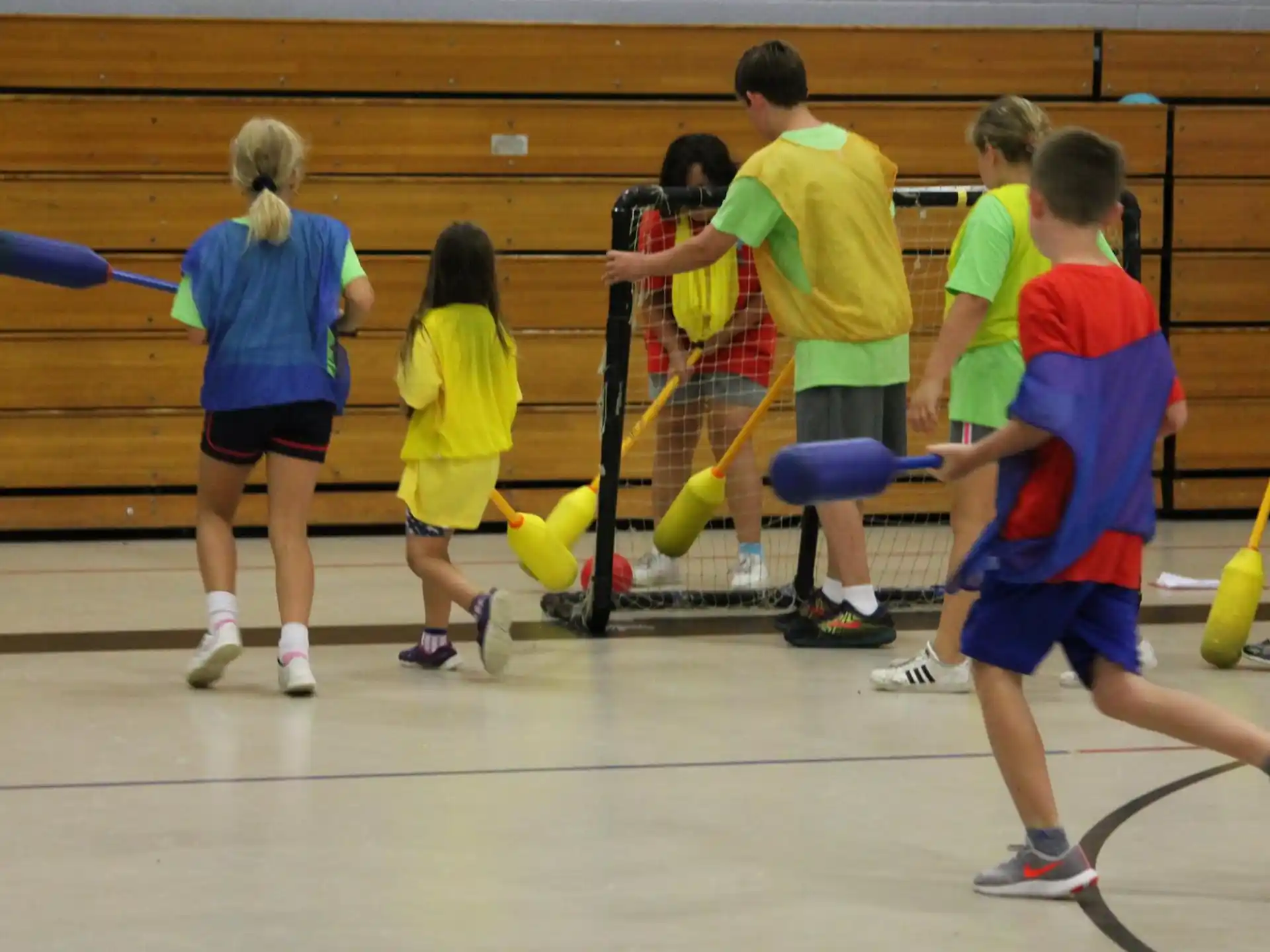 a group of kids playing volleyball