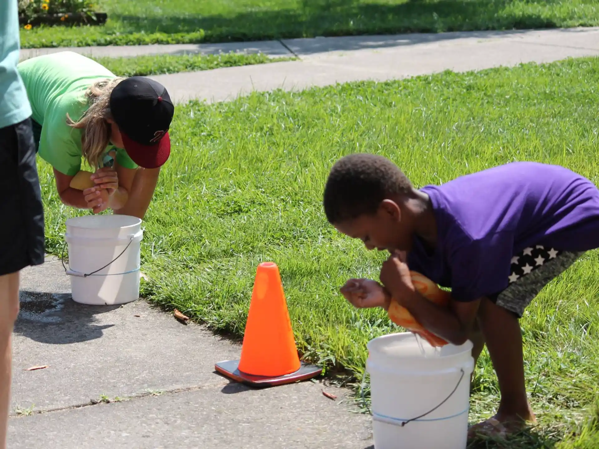 a group of people playing with a bucket