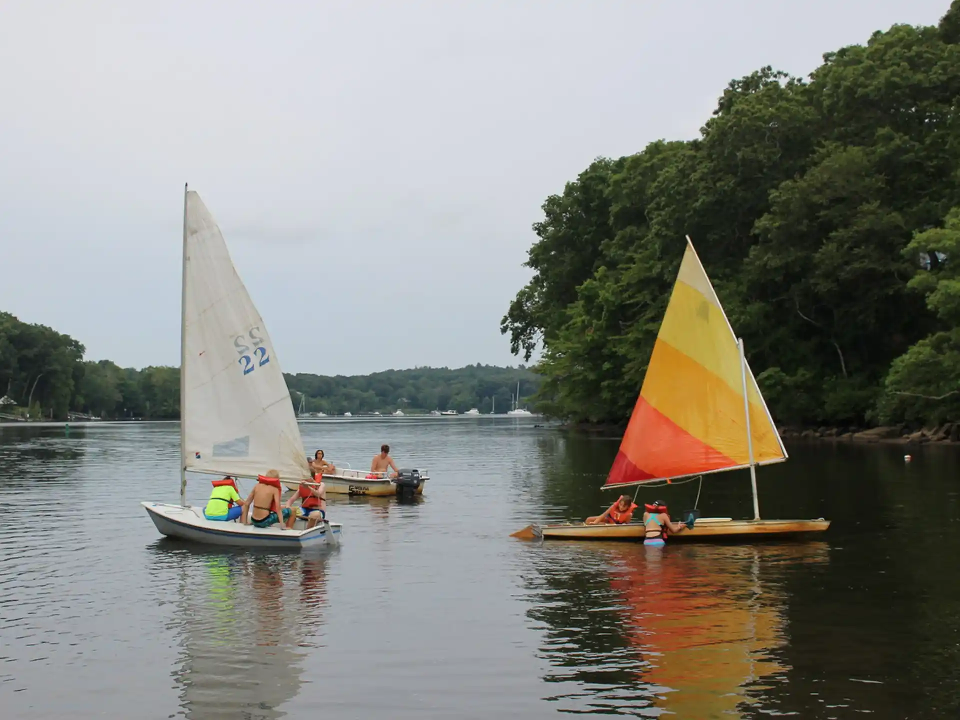 a group of people on boats on a lake