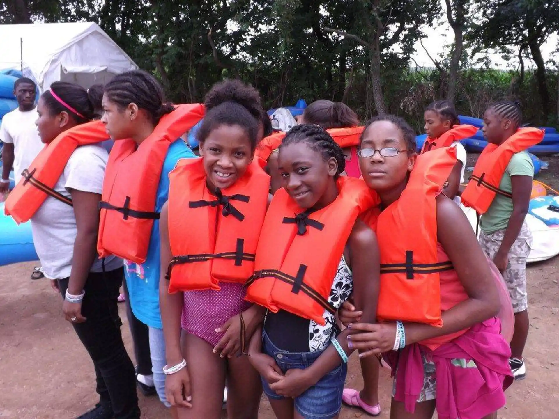 a group of people wearing life vests
