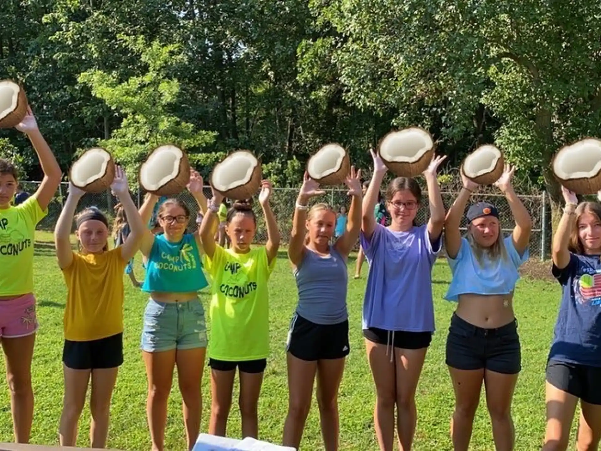 a group of girls holding white objects