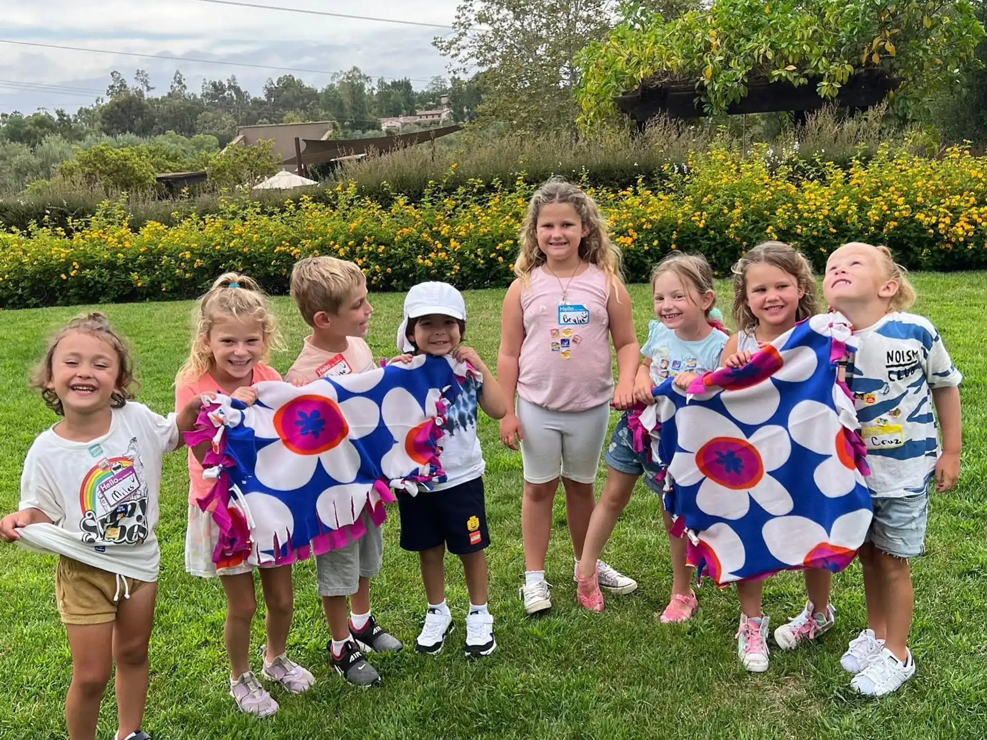 a group of children holding balloons