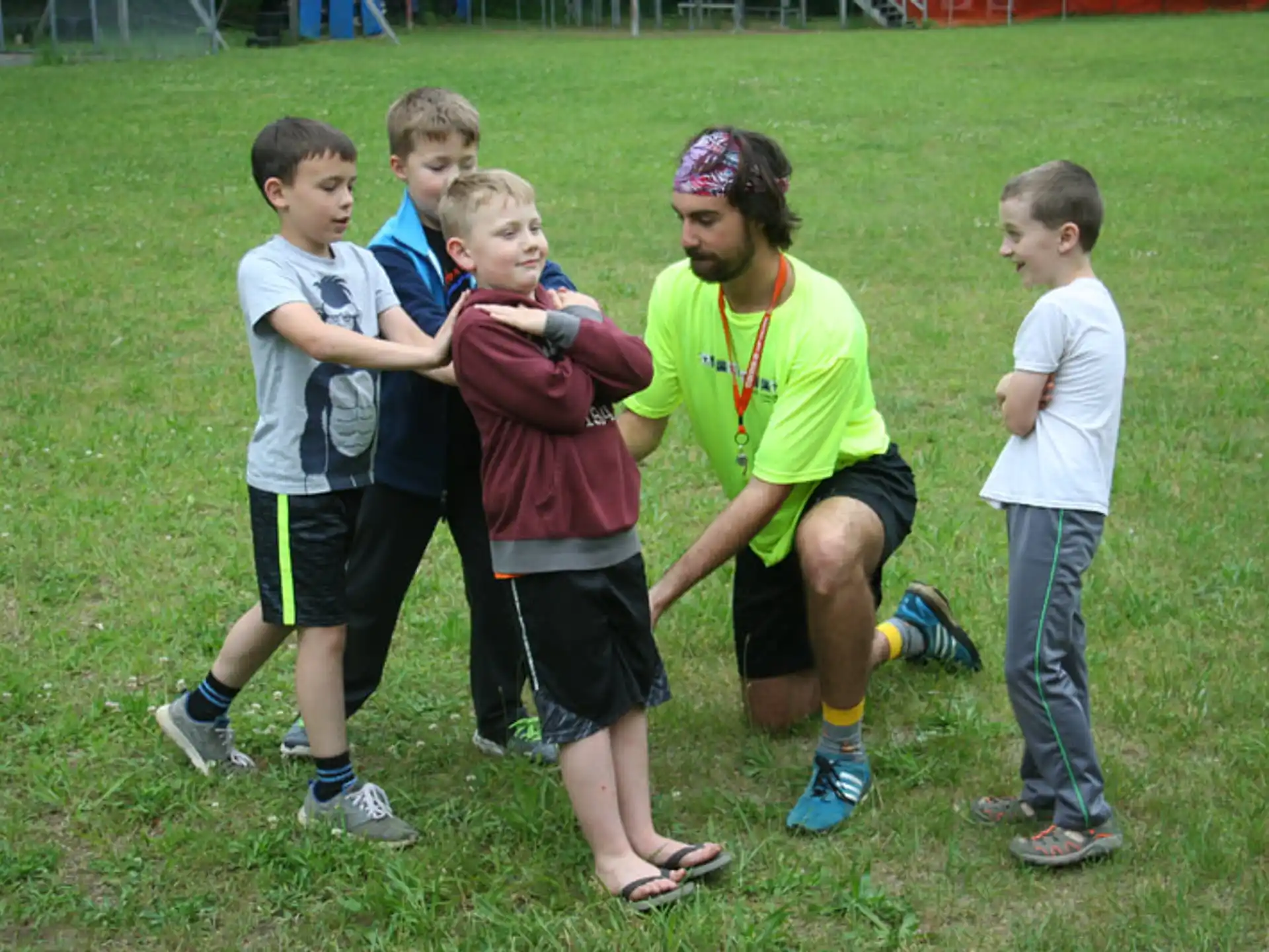 a group of kids playing with a ball