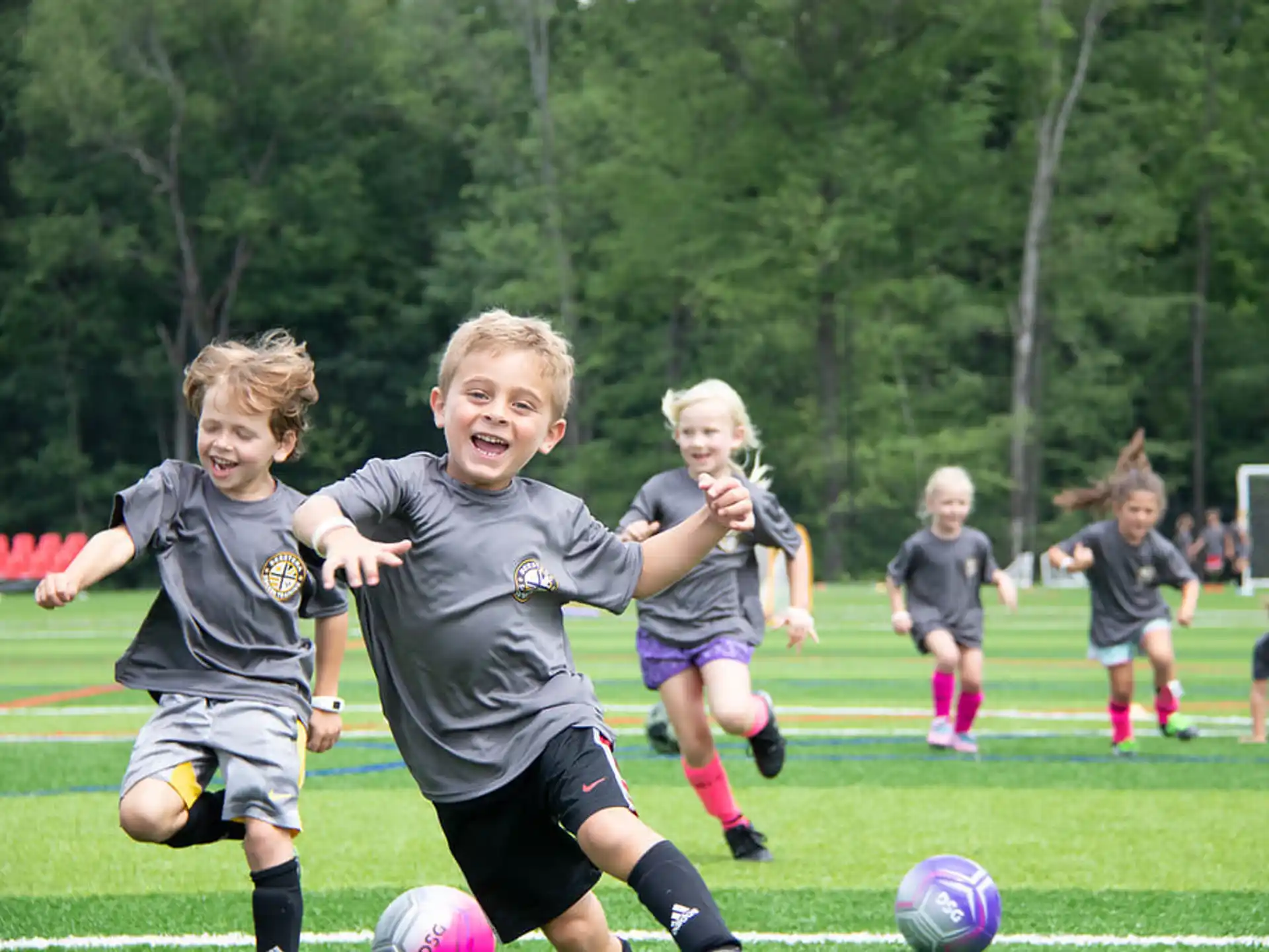 kids playing football on a field
