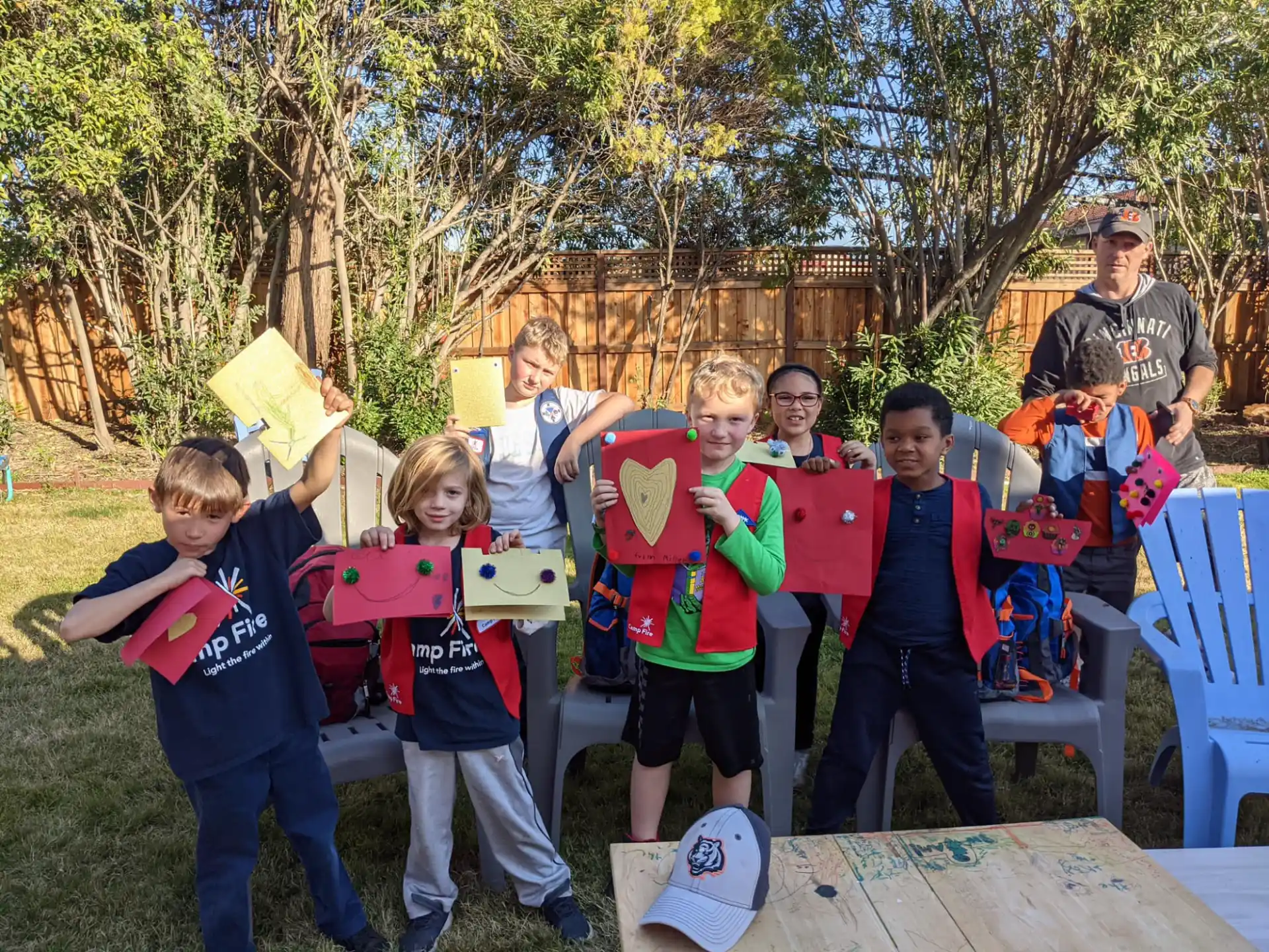 a group of people holding objects