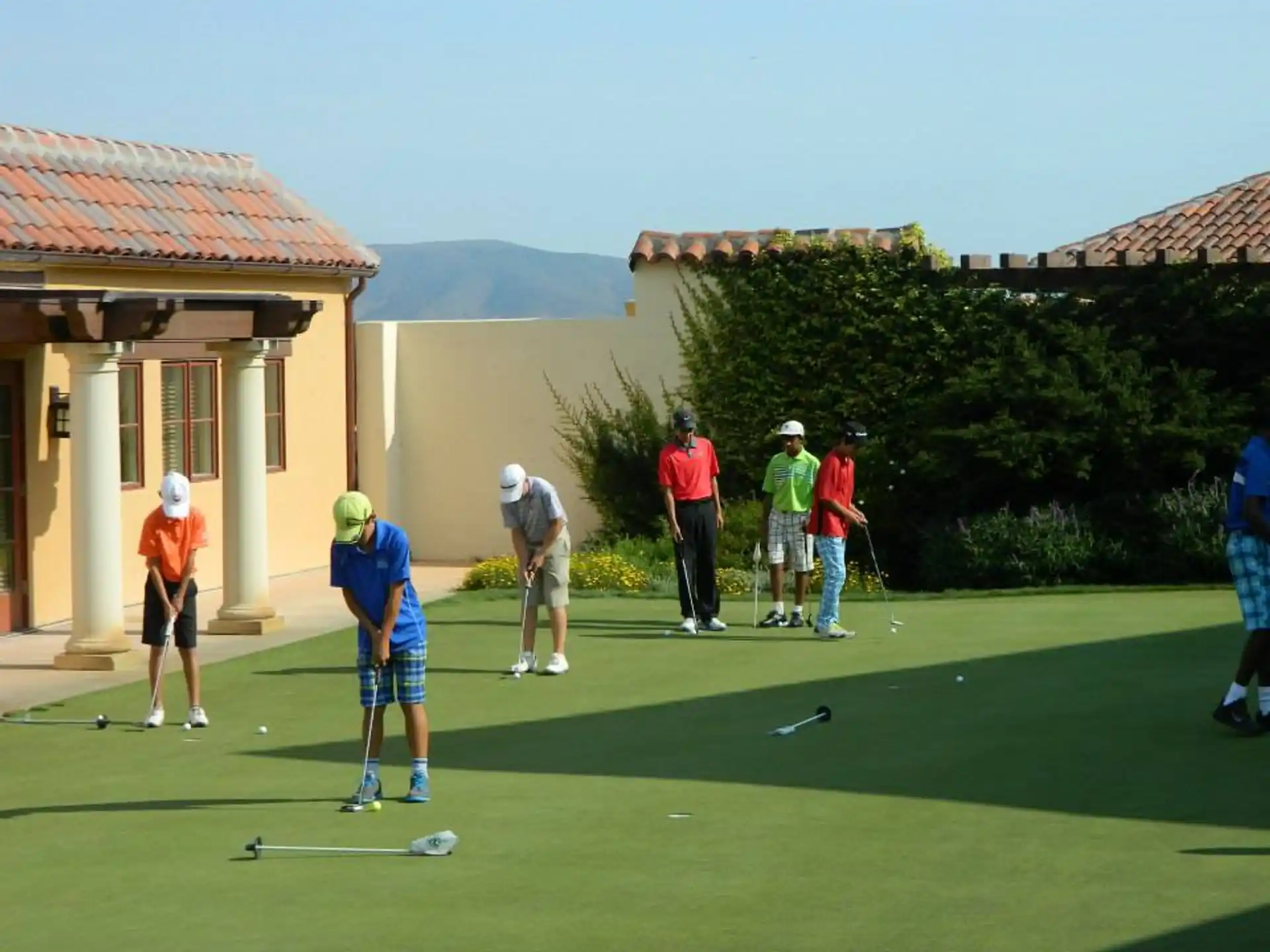 a group of people playing golf