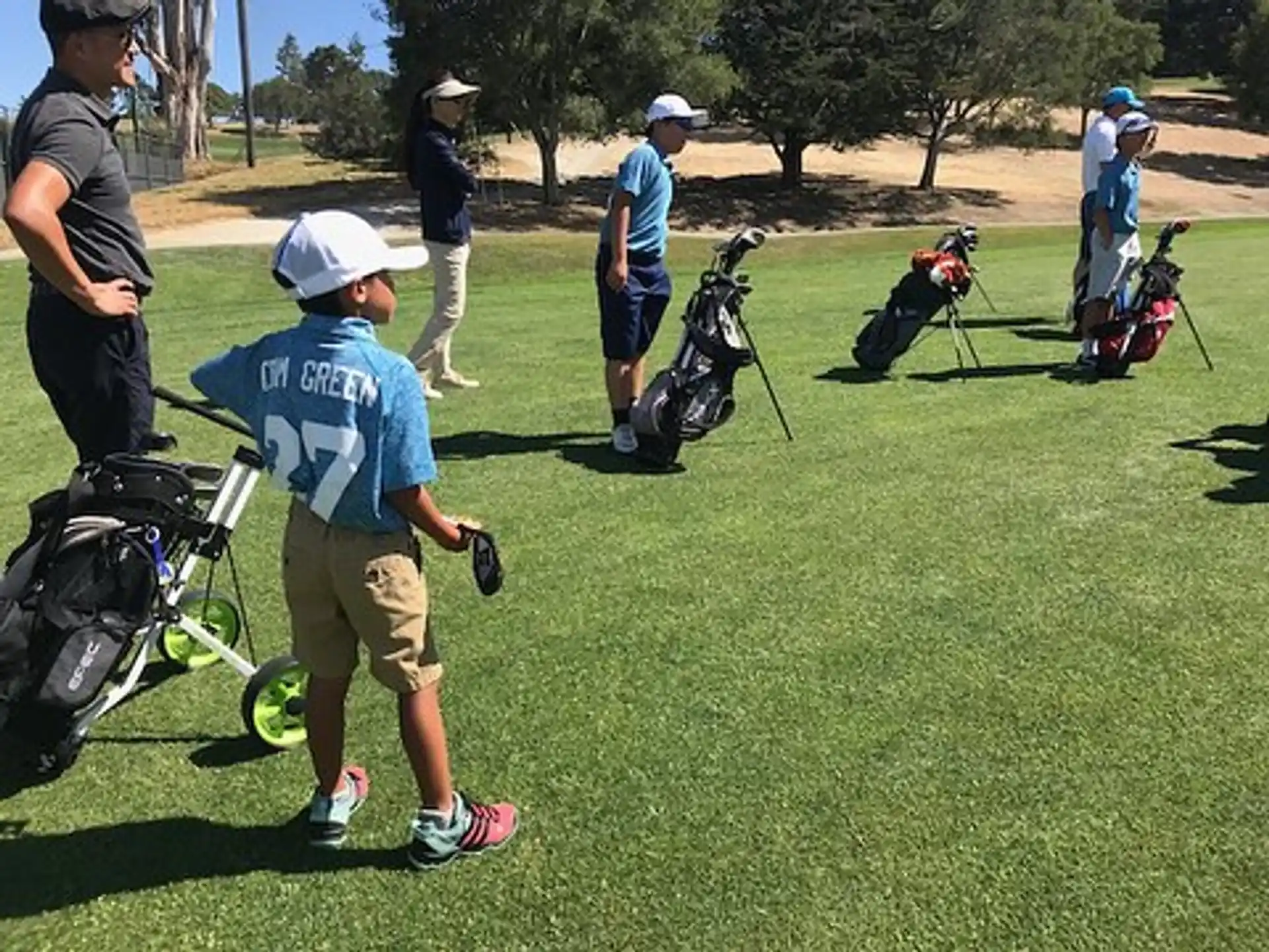 a group of people playing golf