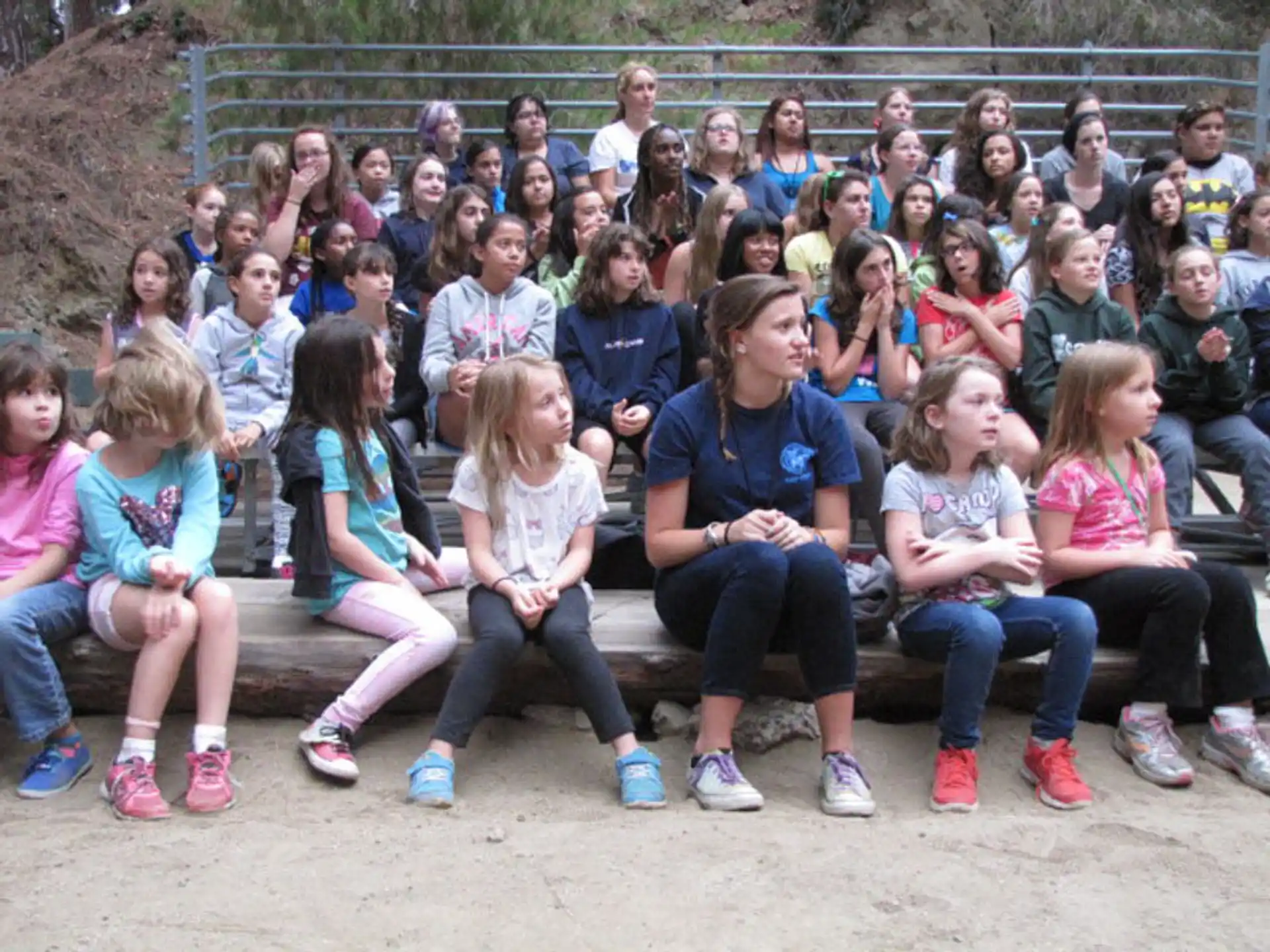 a group of people sitting on a bench