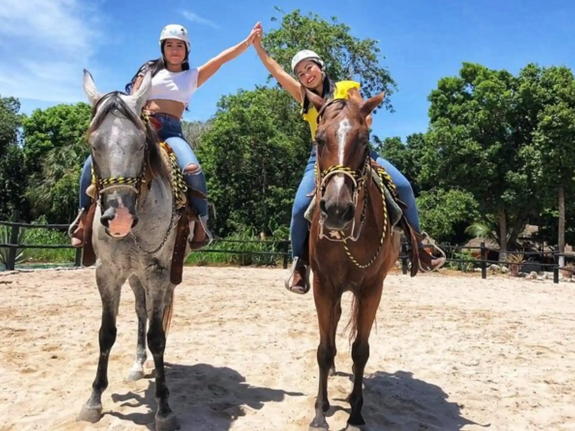 a group of people riding horses