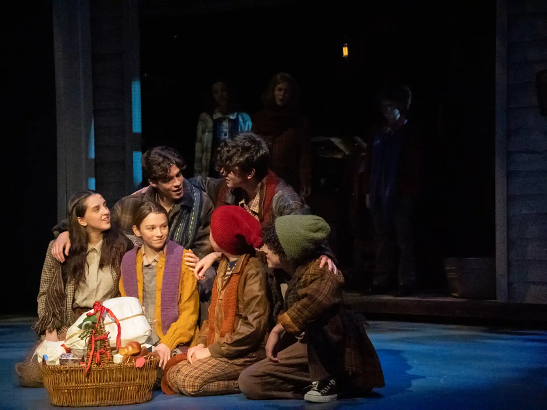 a group of people sitting on the floor