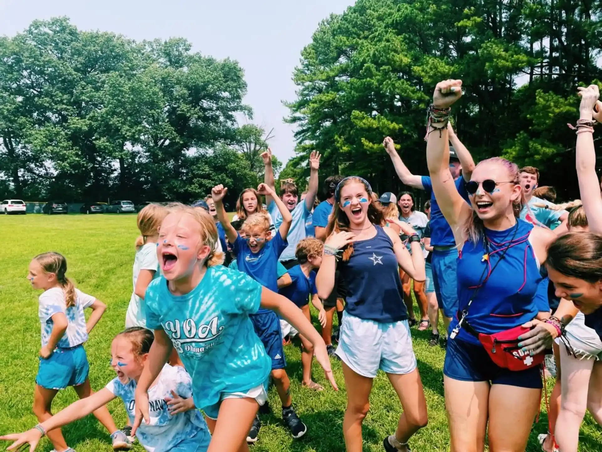 a group of girls in blue shirts
