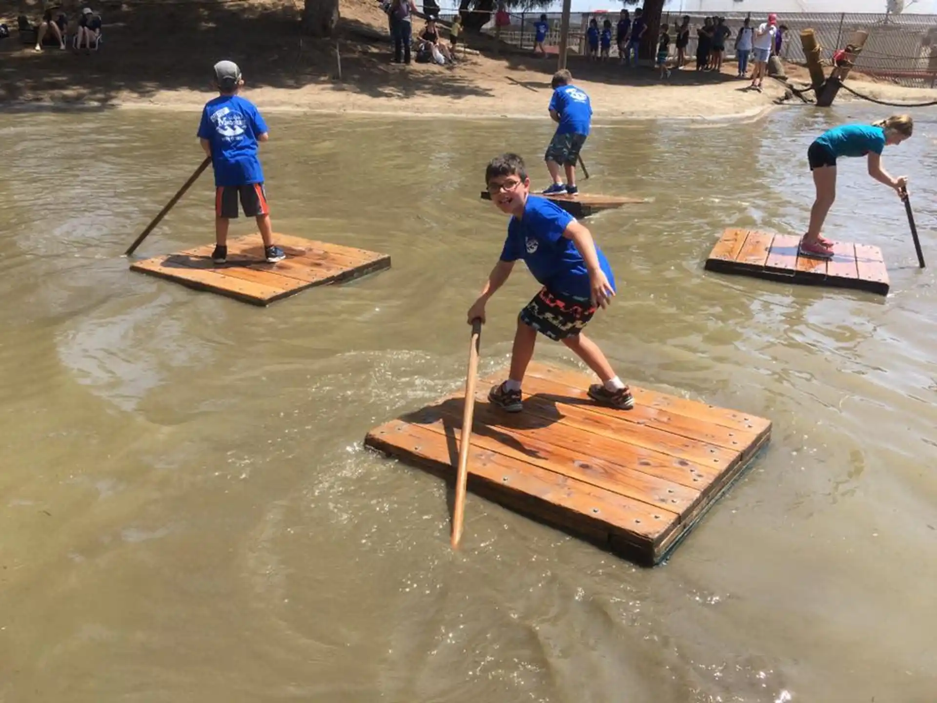 a group of people in a river