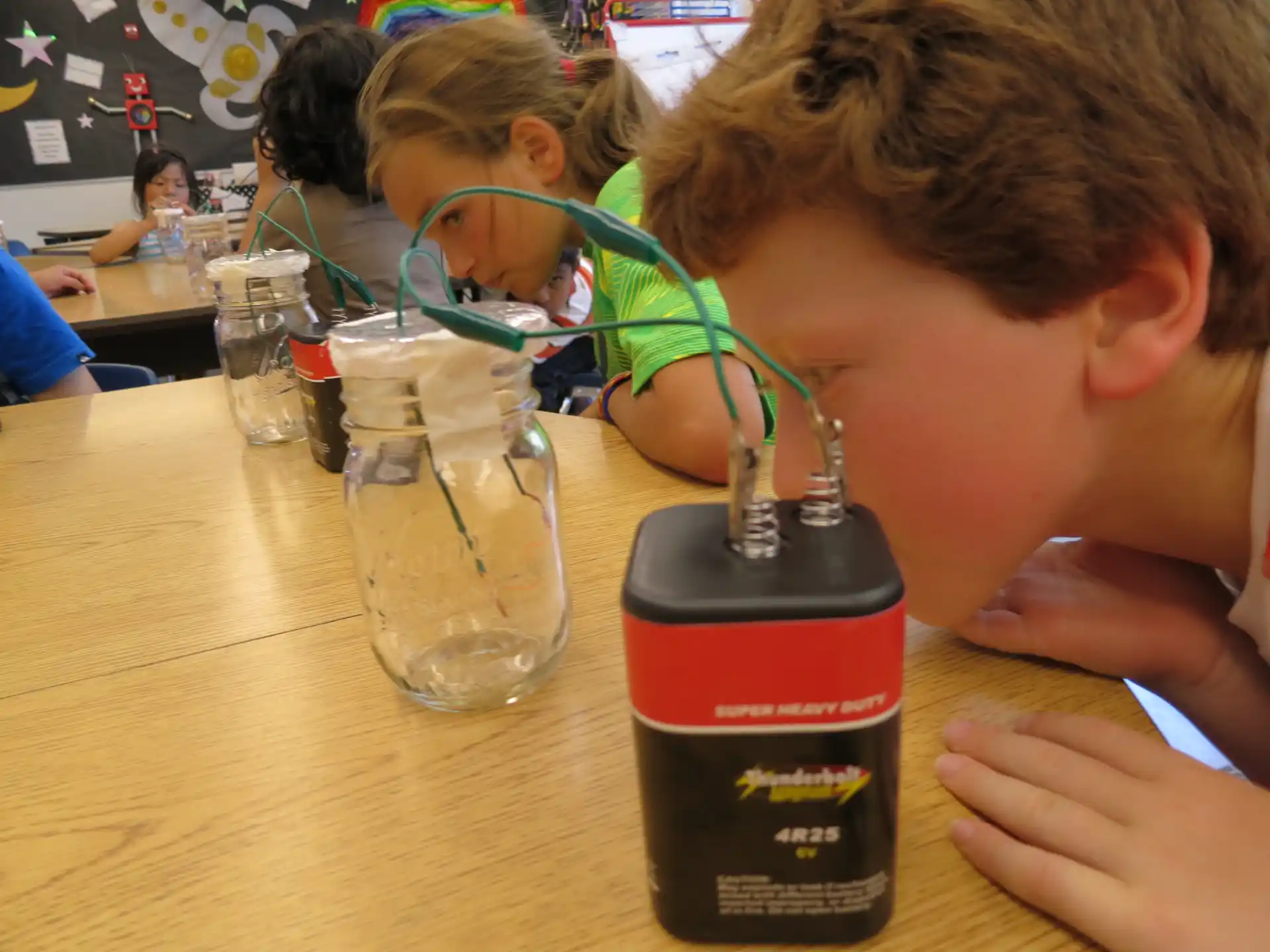 a boy drinking from a bottle