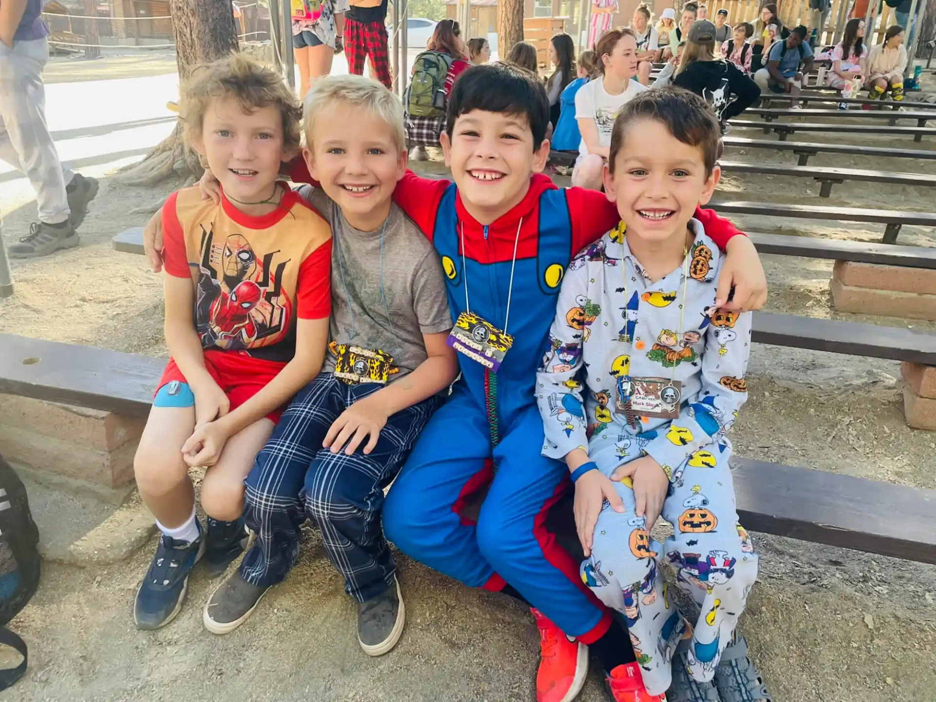 a group of children sitting on a bench